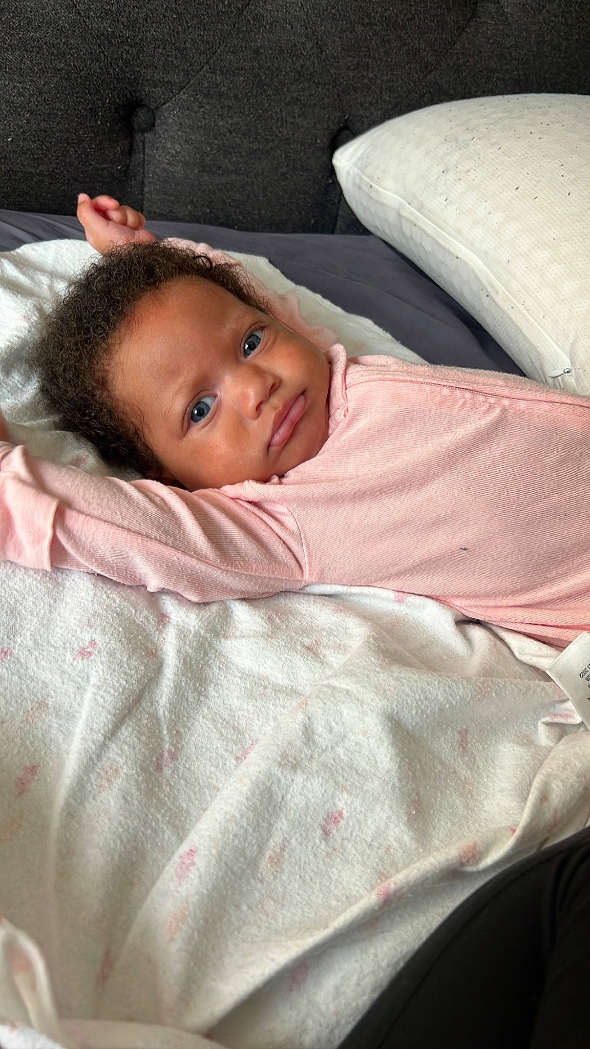 Amira is registered to the contest to win money with this photo: baby, bed_sheet, bedding, bedtime, blanket, cheek, child, comfort, couch, fur, linens, nap, nose, person, room, sitting, skin, sleep, textile, toddler