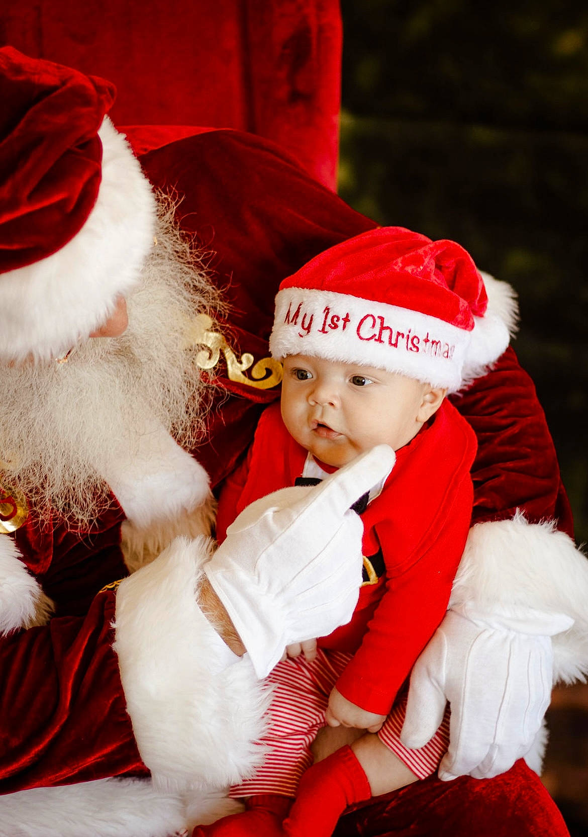 Jenson is registered to the contest to win money with this photo: baby, beard, christmas, christmas_eve, costume_hat, event, fictional_character, fun, fur, fur_clothing, happy, hat, headwear, holiday, human_body, lap, person, red, santa_claus, toddler