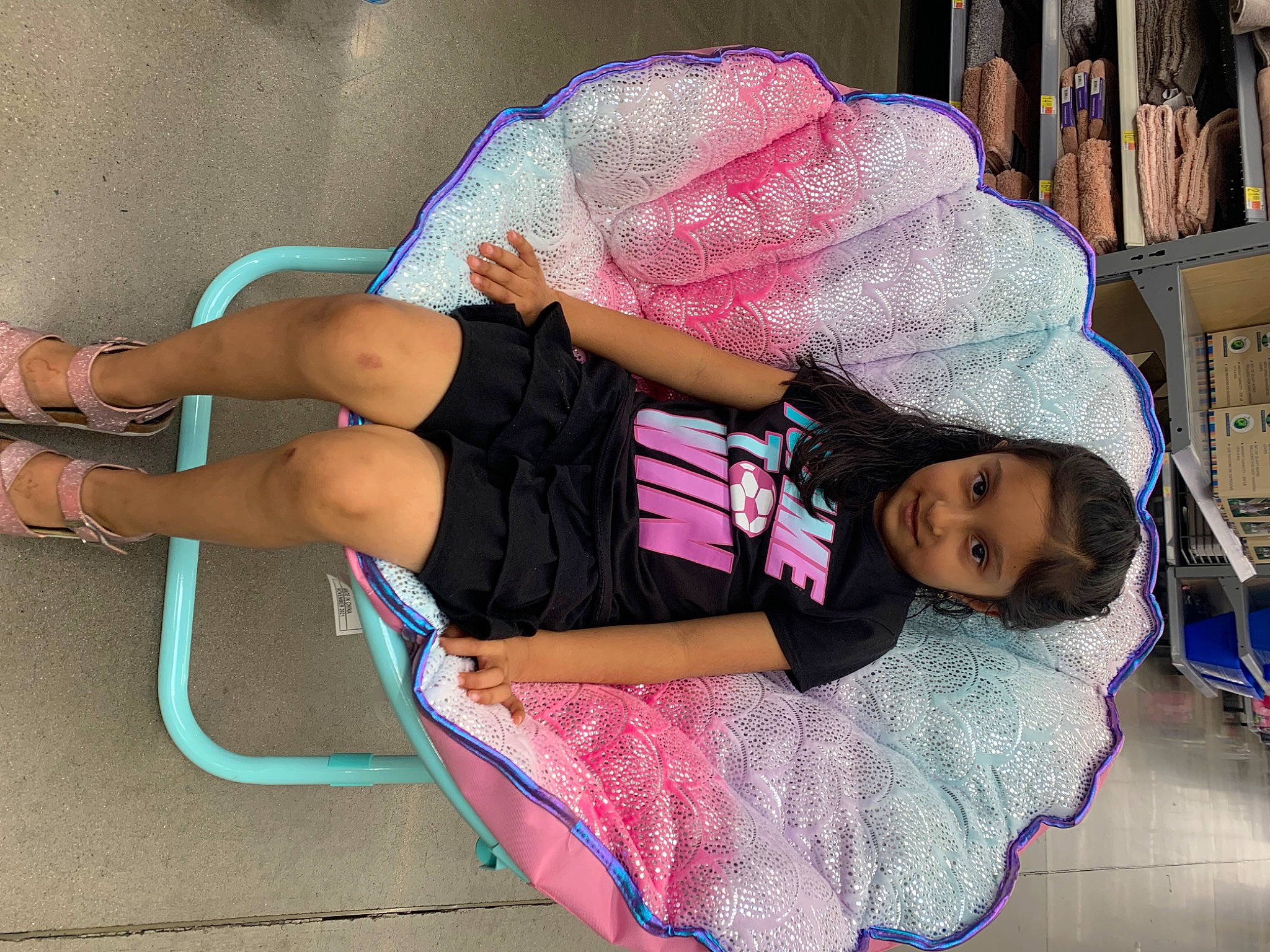 Tanya Shah is registered to the contest to win money with this photo: child, comfort, electric_blue, fun, happy, hat, human_body, human_leg, joint, joy, knee, lap, leisure, magenta, person, pink, shelf, shorts, textile, thigh