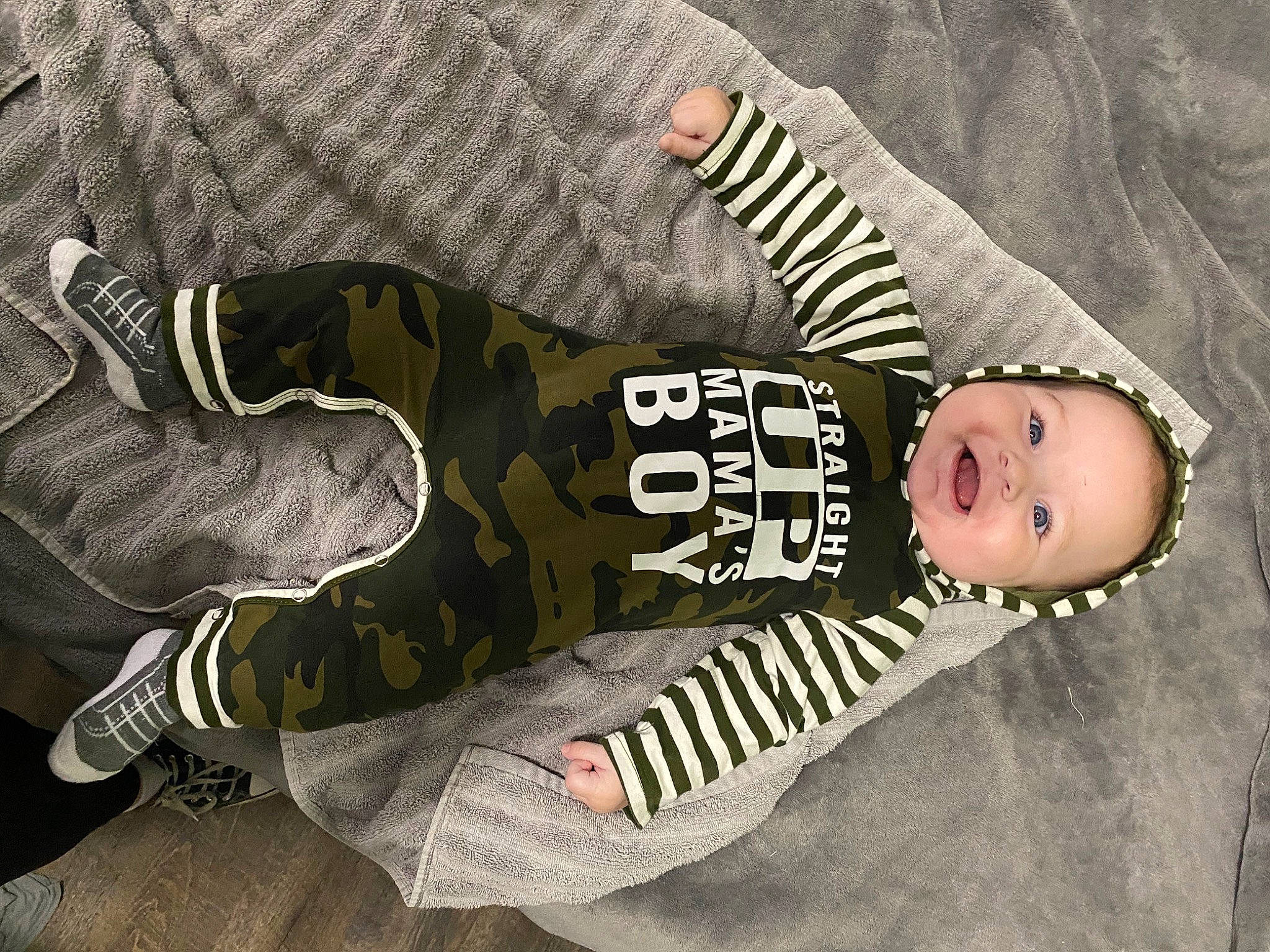 Rayder joined the competition — help win amazing prizes! baby, baby_products, baby_toddler_clothing, camouflage, child, font, fur, gesture, hand, hat, headgear, human_body, military_camouflage, pattern, person, personal_protective_equipment, sleeve, smile, sportswear, t_shirt