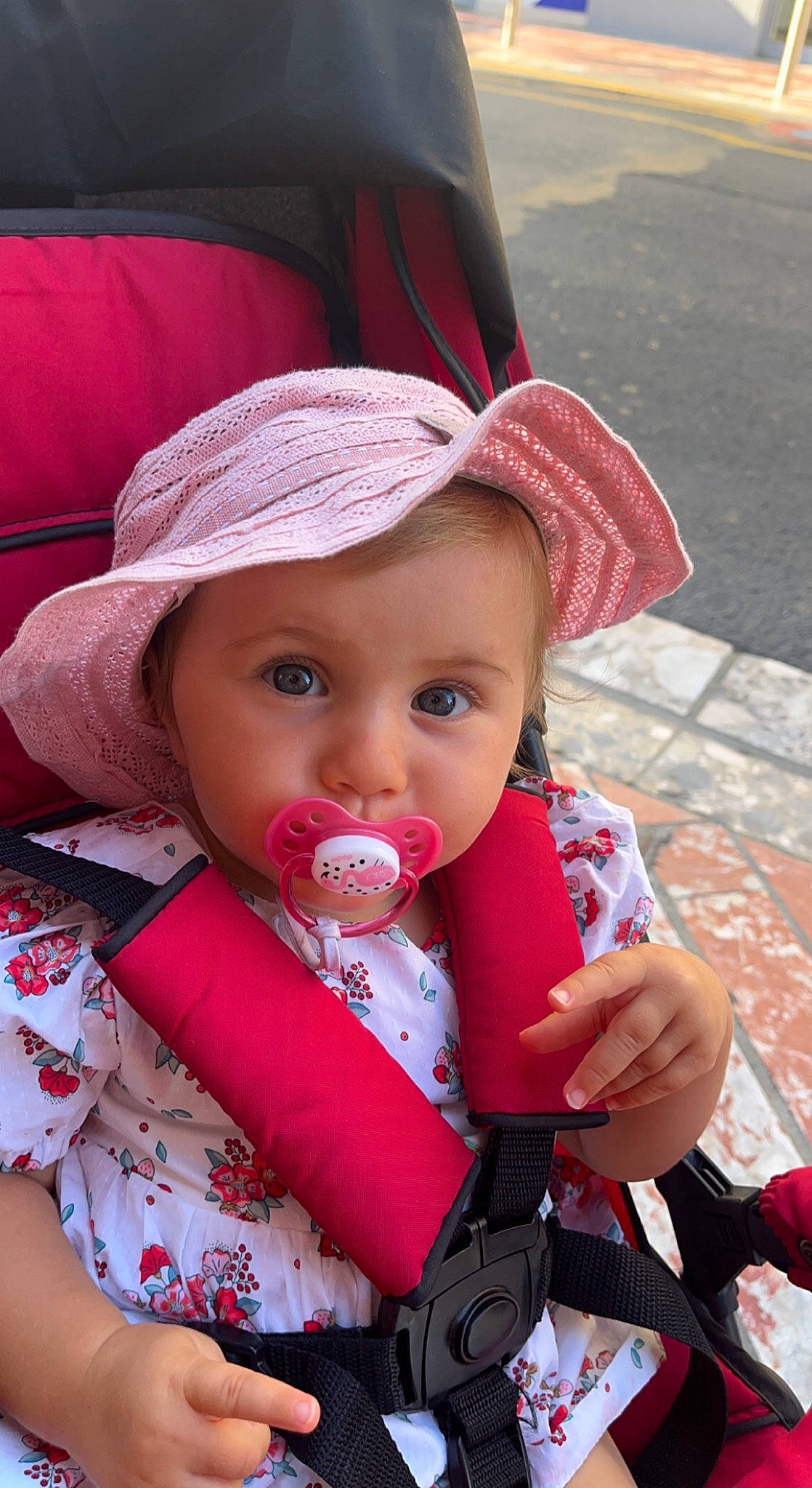 Lyana participe au concours pour gagner de l'argent avec cette photo : baby, baby_toddler_clothing, cap, cheek, child, eye, face, facial_expression, hat, head, headwear, lip, mouth, organ, outerwear, person, pink, product, red, skin