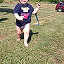 barefoot, blue_sky, car, casual, child, daytime, grass, greenery, happy, nature, outdoor, pacifier, playing, running, shirt, smiling, sunny, toddler, tree, young_child