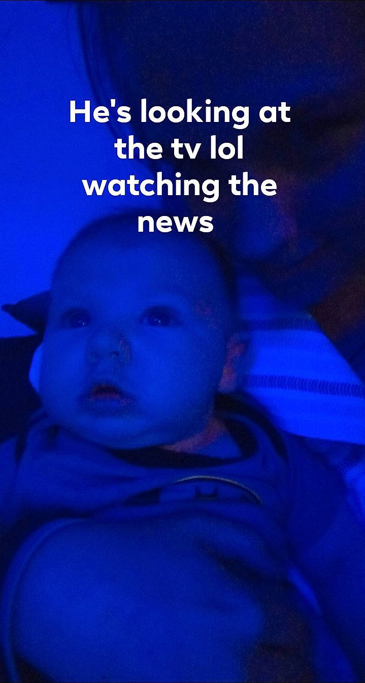 Derrick is registered to the contest to win money with this photo: baby, baby_toddler_clothing, blue, child, darkness, electric_blue, font, happy, magenta, person, photo_caption, sleeve, toddler, under_exposed, violet