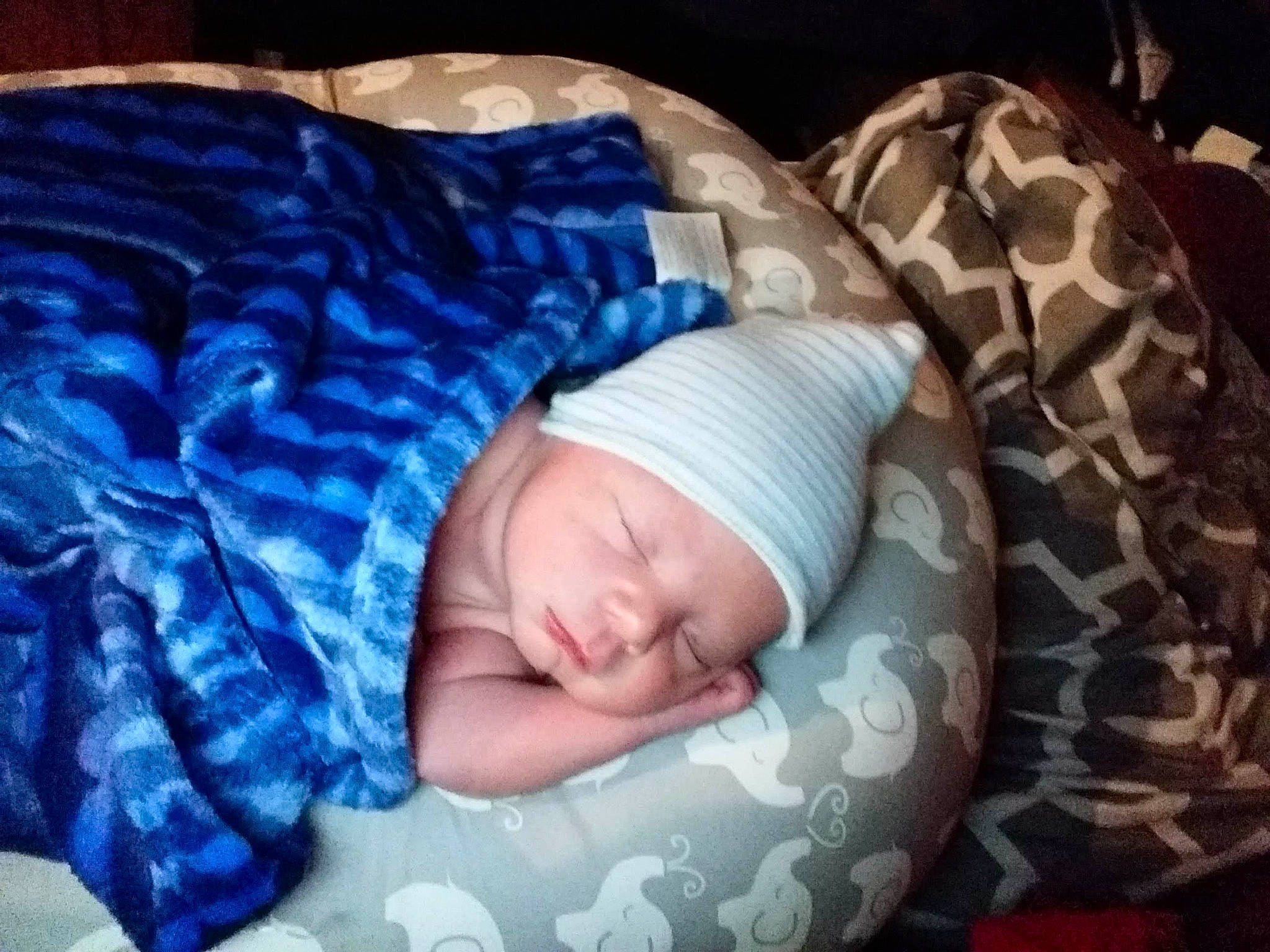 Alexander is registered to the contest to win money with this photo: baby, baby_products, baby_safety, baby_sleeping, baby_toddler_clothing, bedding, bedtime, child, comfort, electric_blue, face, headwear, infant_bed, knit_cap, linens, nap, pattern, person, room, sleep