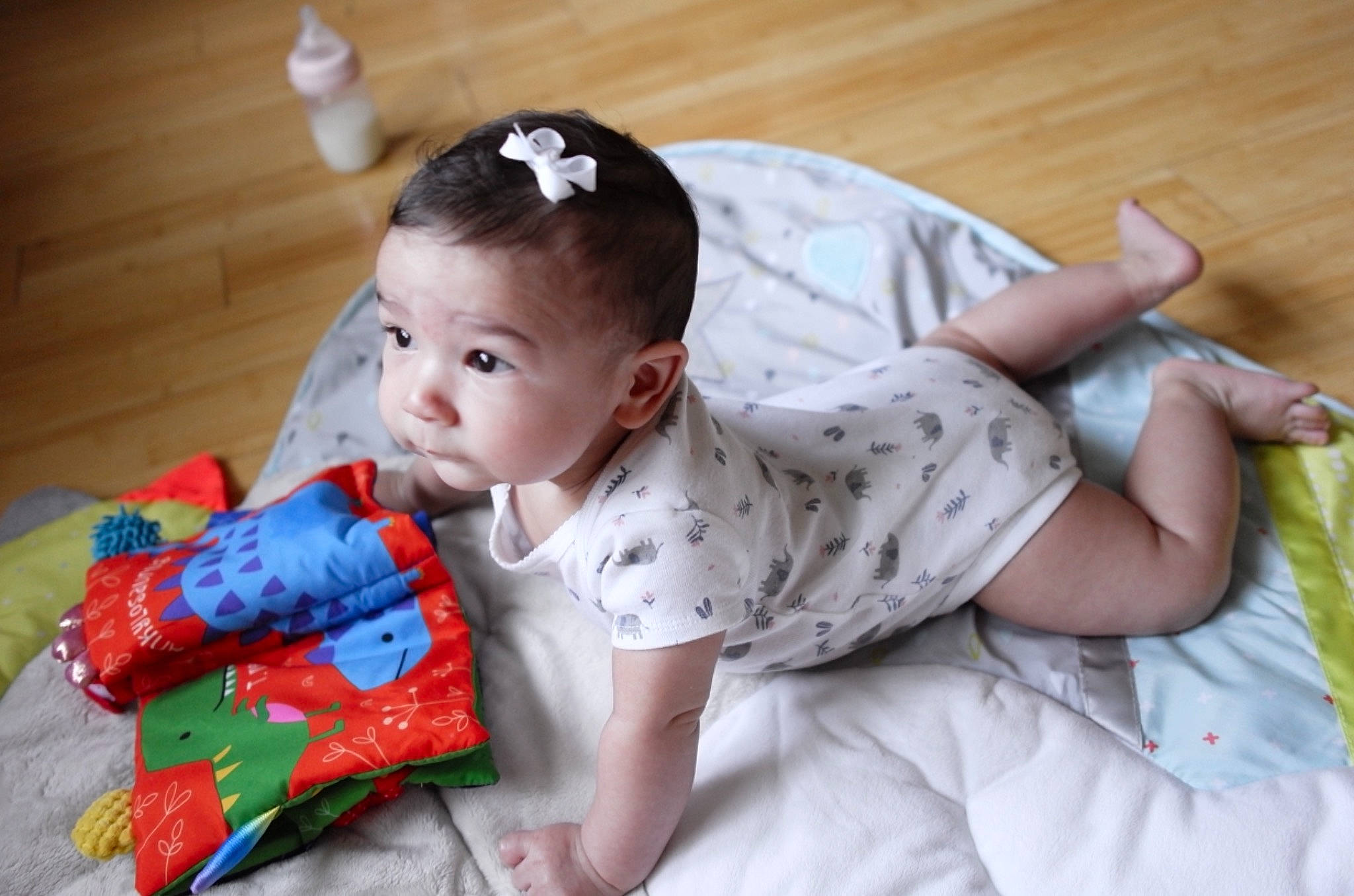 Colette joined the competition — help win amazing prizes! baby, baby_toddler_clothing, child, comfort, fashion_accessory, flooring, fun, grass, happy, headband, iris, linens, pattern, person, portrait_photography, room, sitting, skin, sleeve, toddler