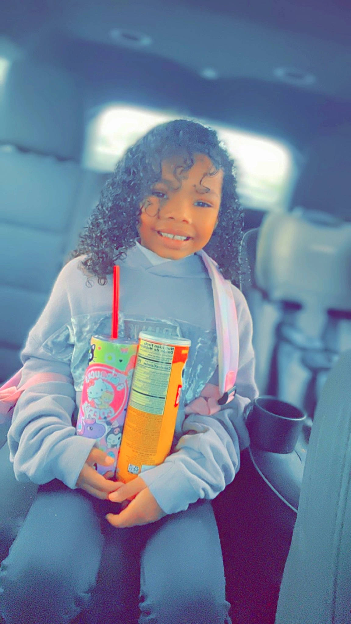 Cataleya is registered to the contest to win money with this photo: afro, car_seat, child, cool, electric_blue, event, fun, happy, human_body, jewellery, joy, leisure, necklace, person, play, sitting, thigh, toddler, vacation