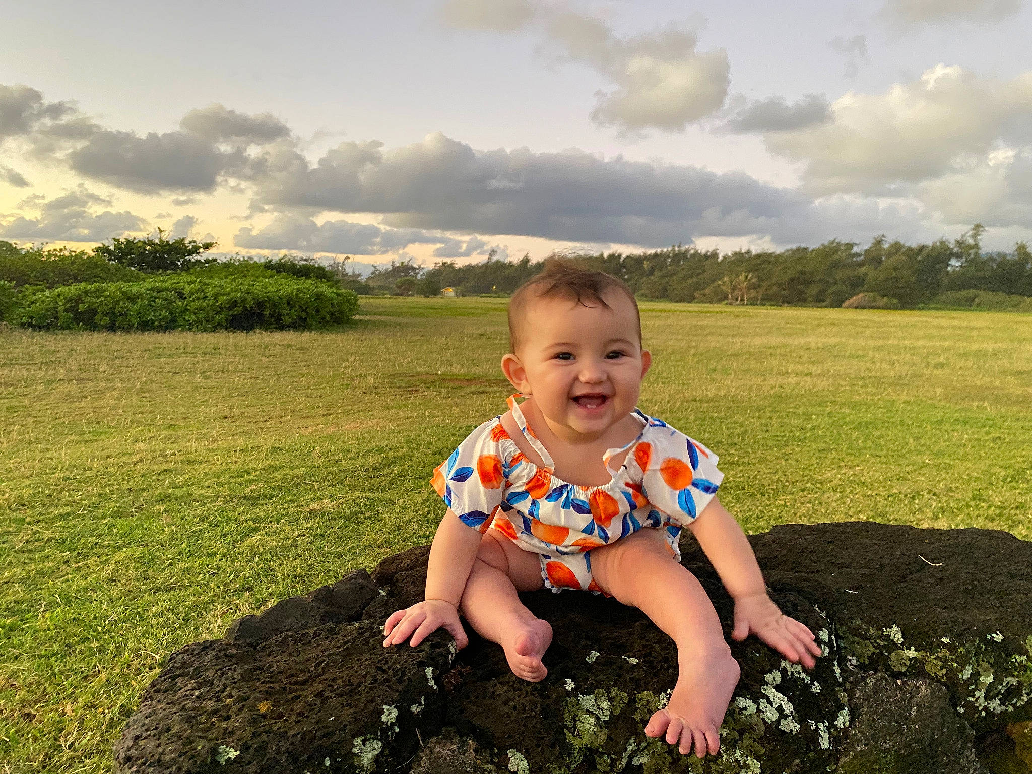 Mia is registered to the contest to win money with this photo: baby_toddler_clothing, cloud, flash_photography, fun, grass, grassland, happy, horizon, joy, landscape, leisure, meadow, people_in_nature, person, plain, prairie, sky, smile, standing, summer