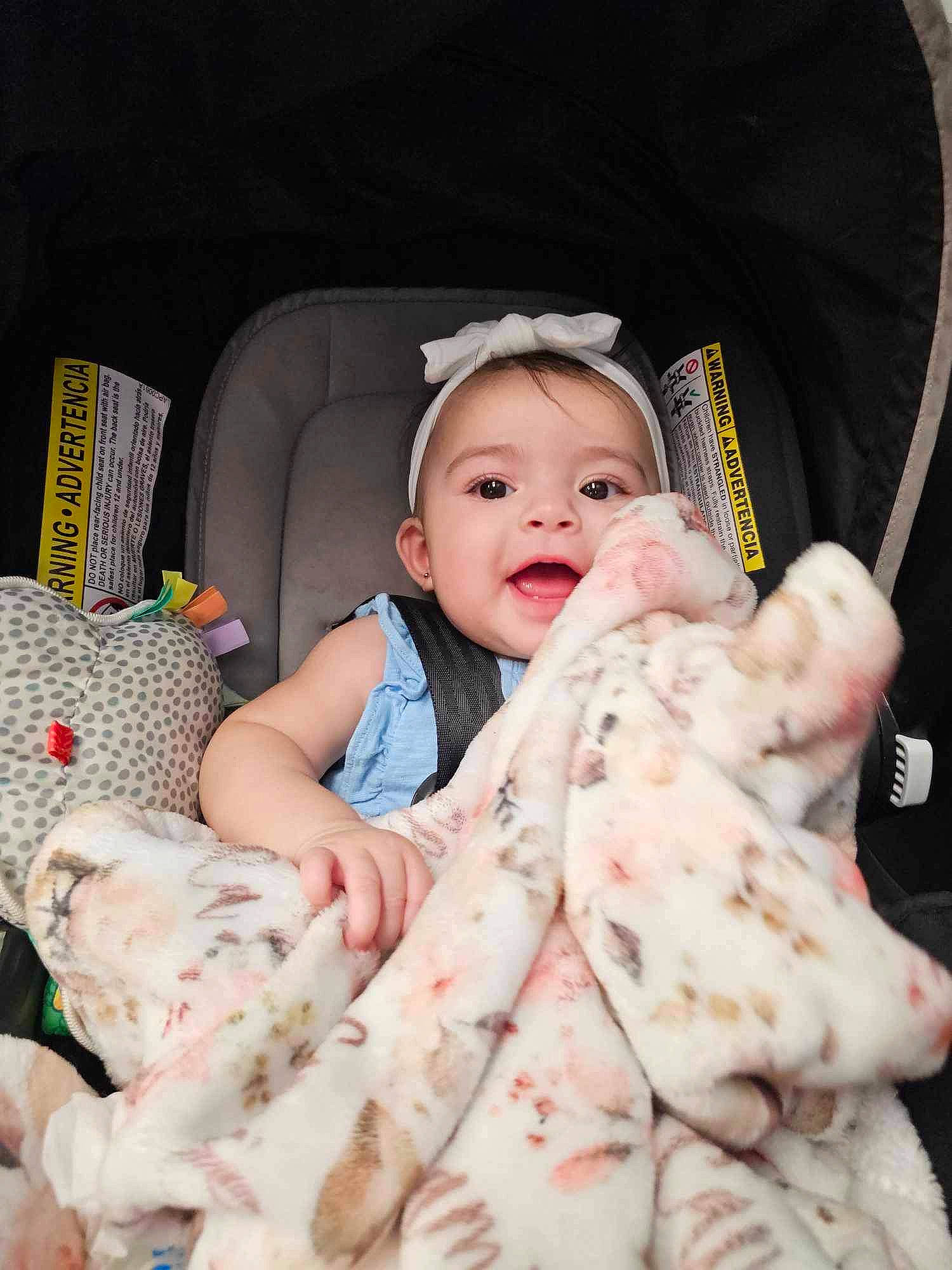 Camilla joined the competition — help win amazing prizes! baby, baby_products, baby_toddler_clothing, bedding, car_seat, cheek, child, comfort, face, fur, happy, linens, pattern, person, pink, room, sitting, skin, smile, toddler