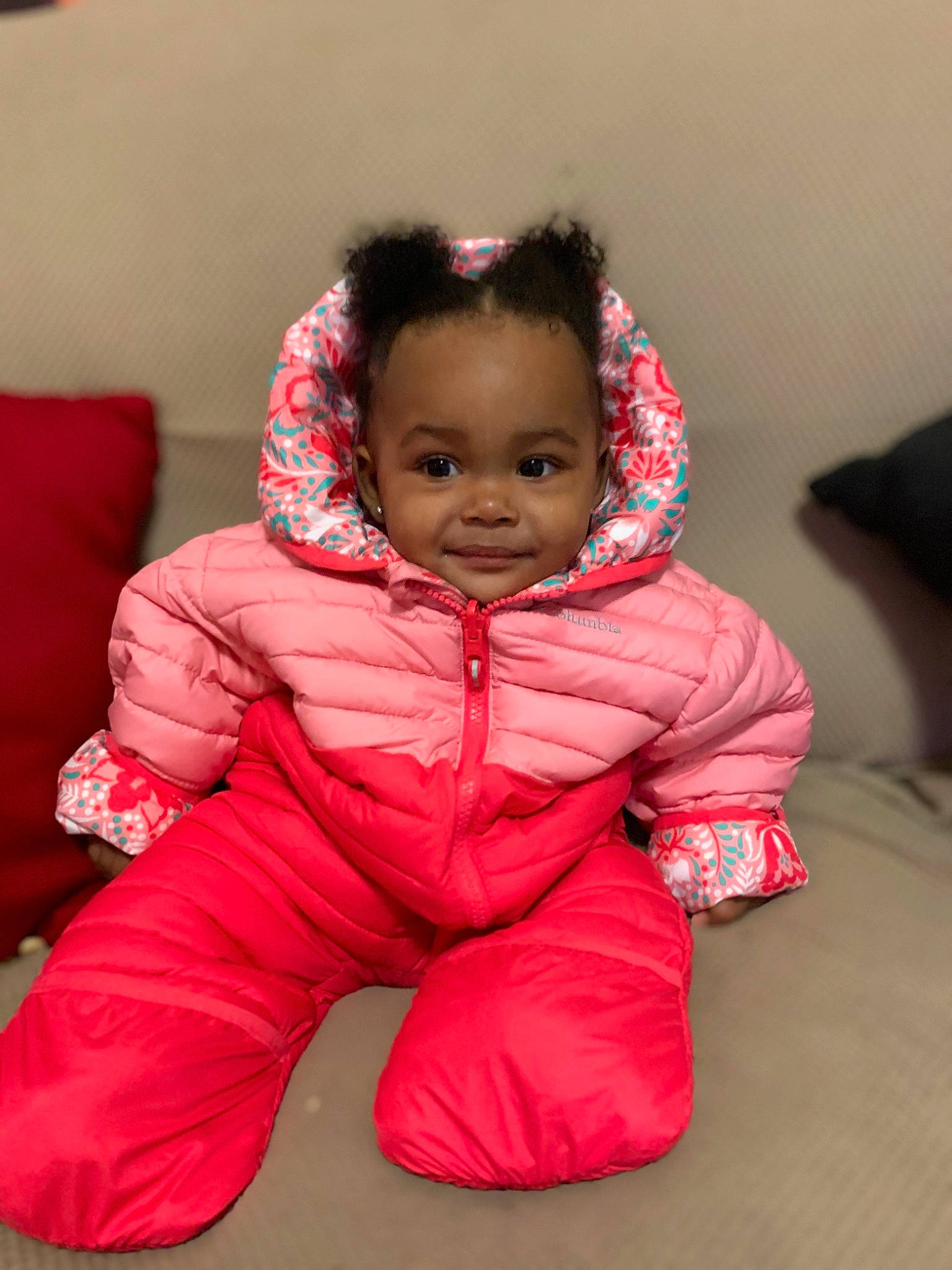 Jaionna is registered to the contest to win money with this photo: baby, baby_toddler_clothing, cheek, child, comfort, couch, hood, nightwear, overall, pajamas, person, pillow, pink, sitting, skin, sleeve, textile, toddler