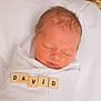 David is registered to the contest to win money with this photo: newborn, baby, sleeping, blanket, basket, wooden_tiles, name, peaceful, infant, wrapped, resting, cute, portrait, soft, white, child, face, sleep, calm, newborn_baby