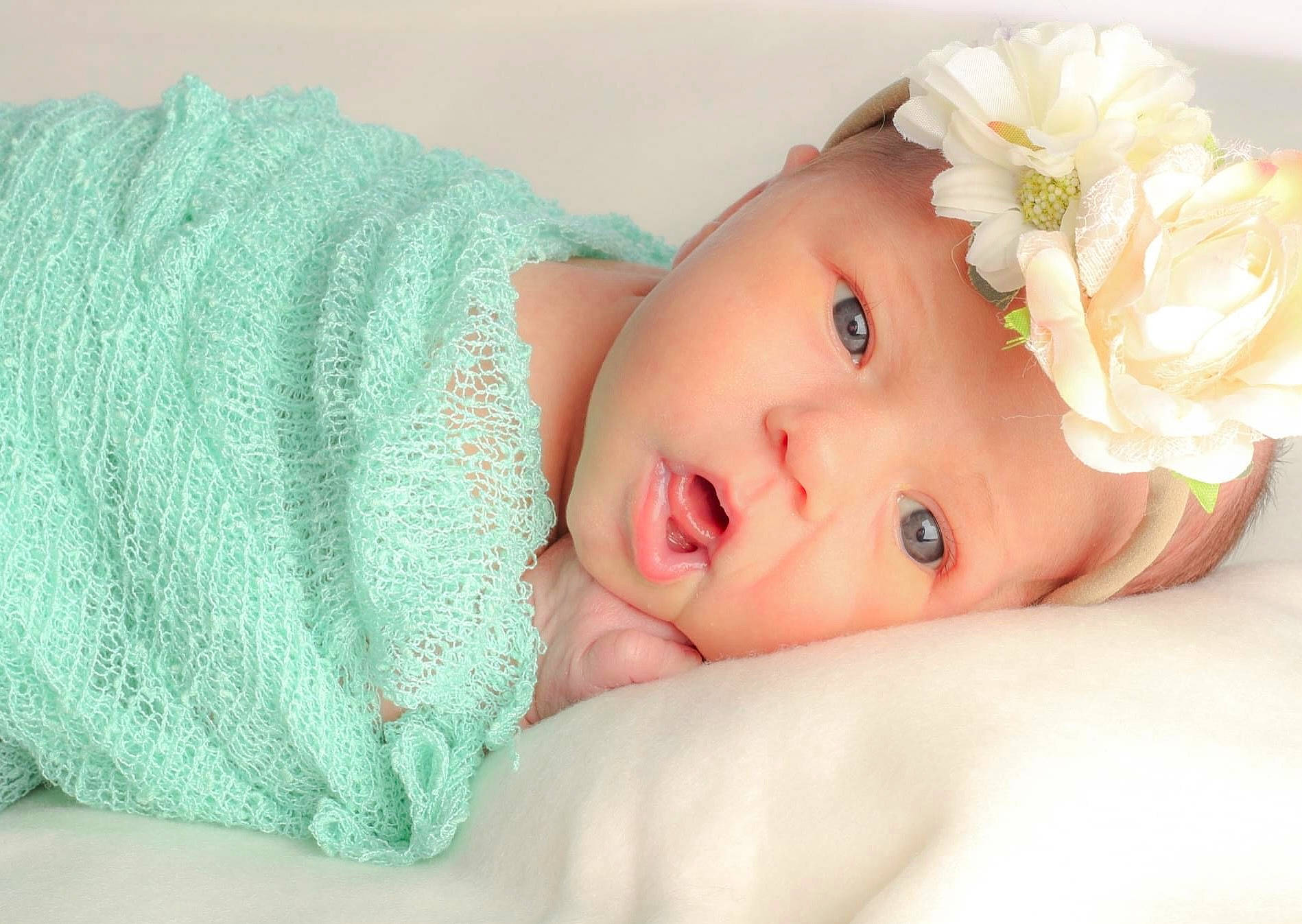 Austyn joined the competition — help win amazing prizes! baby, baby_toddler_clothing, cap, cheek, child, chin, comfort, dress, eye, face, flower, head, headgear, headpiece, headwear, iris, lip, person, petal, skin