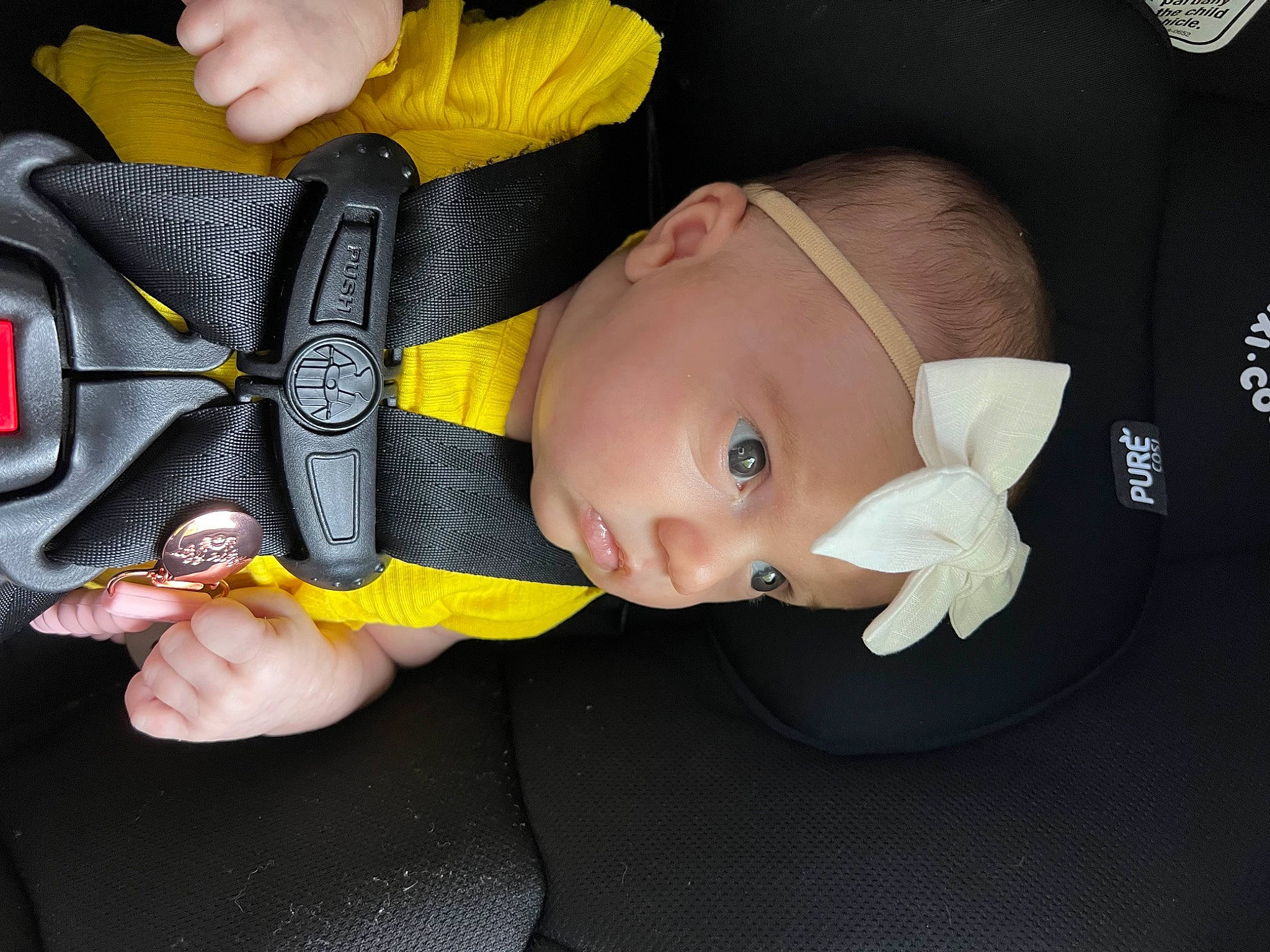 Addy is registered to the contest to win money with this photo: auto_part, baby, baby_carriage, baby_in_car_seat, baby_products, baby_safety, baby_toddler_clothing, car_seat, cheek, child, comfort, finger, flash_photography, fun, gesture, headwear, nose, person, personal_protective_equipment, sleeve