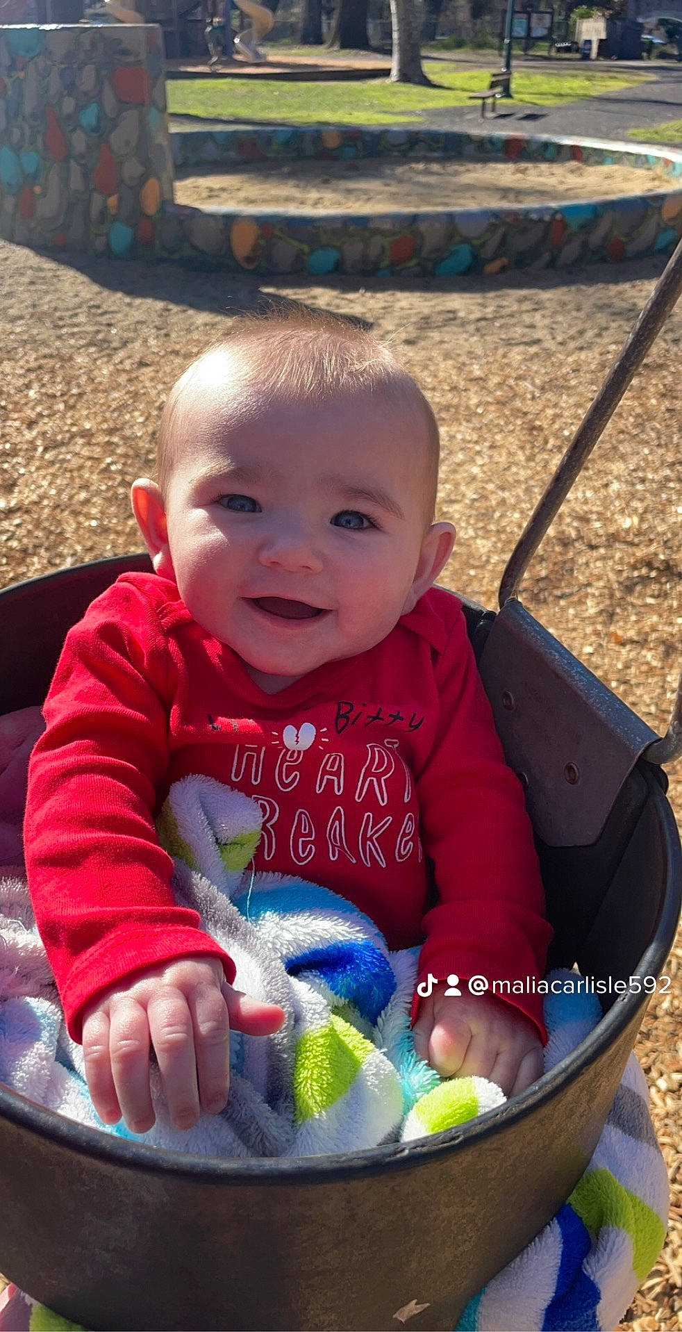 Kailani is registered to the contest to win money with this photo: baby, baby_toddler_clothing, cheek, child, eye, fun, grass, green, happy, head, iris, leisure, mouth, organ, people, person, photograph, product, skin, smile