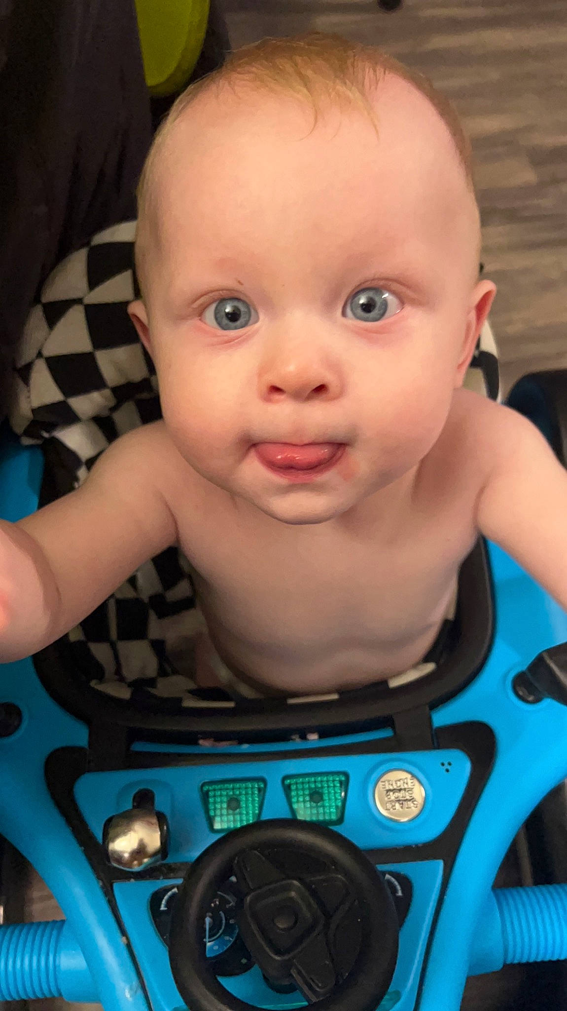 Caiden joined the competition — help win amazing prizes! baby, baby_toddler_clothing, cheek, child, chin, electric_blue, eyelash, fun, happy, iris, nose, person, product, sitting, skin, smile, steering_wheel, thumb, toddler
