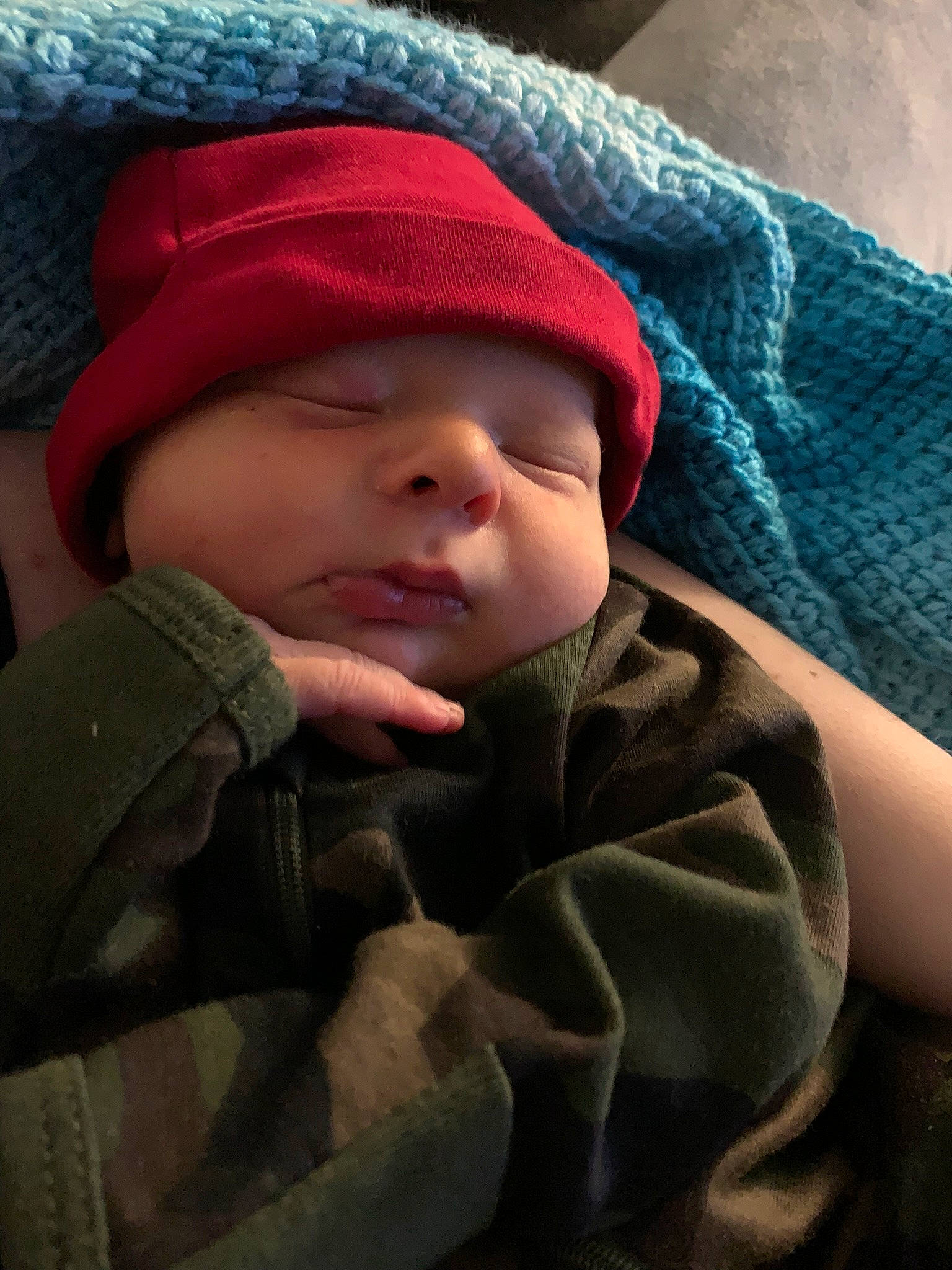 Caiden is registered to the contest to win money with this photo: baby, baby_toddler_clothing, beanie, cap, cheek, child, comfort, headgear, headwear, knit_cap, linens, nap, person, sitting, skin, sleep, thumb, toddler, wool, woolen