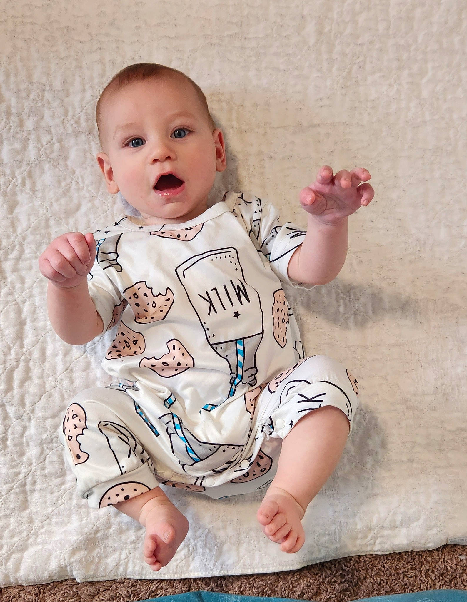 Lux is registered to the contest to win money with this photo: arm, baby, baby_toddler_clothing, cheek, chin, eye, face, facial_expression, finger, happy, head, infant_bodysuit, iris, lip, neck, person, pink, skin, sleeve, standing