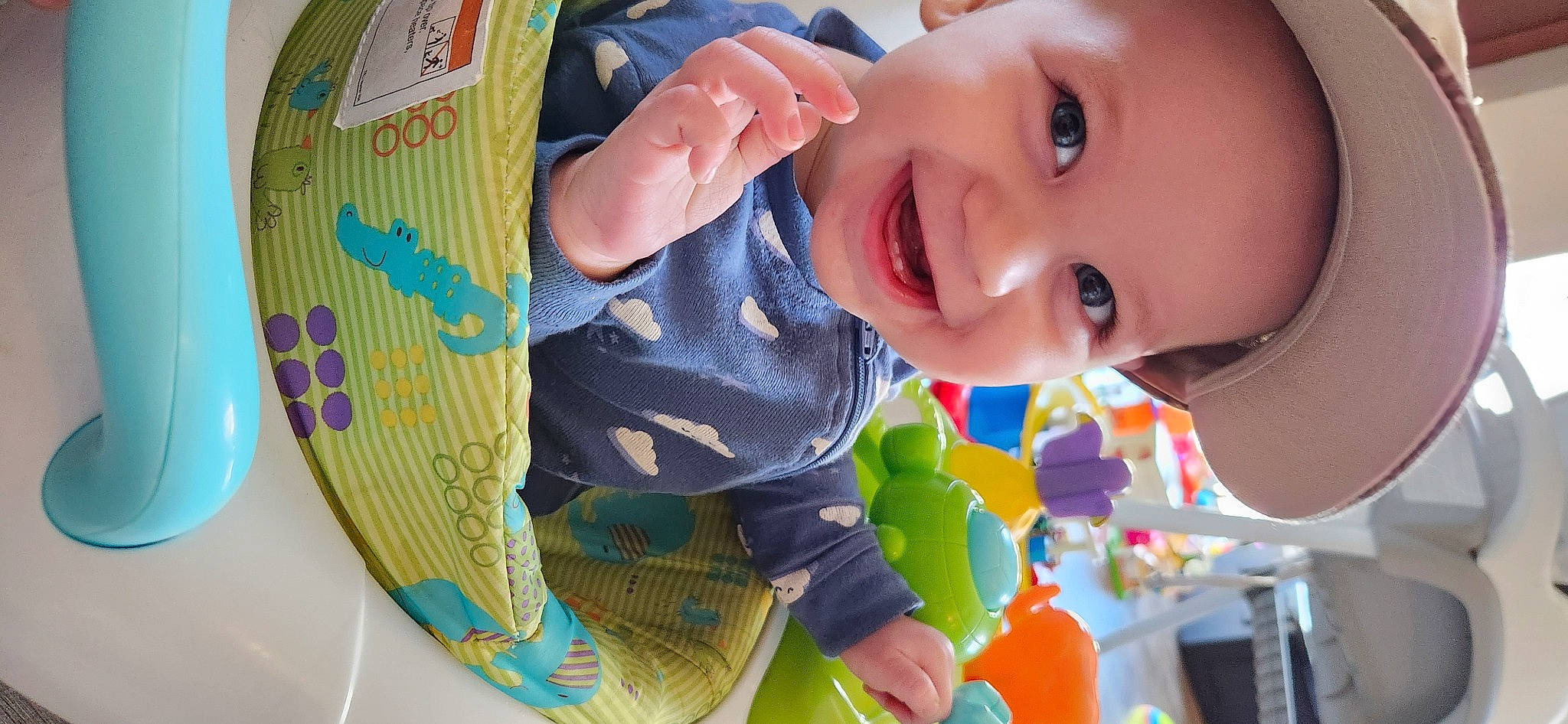 Lux is registered to the contest to win money with this photo: baby, baby_laughing, baby_playing_with_toys, baby_products, baby_toddler_clothing, baby_toys, cheek, child, circle, fun, happy, joy, laugh, leisure, person, play, product, recreation, room, smile