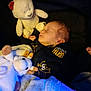 baby, sleeping, plush_toy, blanket, infant, cozy, soft_toy, child, sleep, cute, clothing, comfort, indoors, peaceful, portrait, rest, warm_light, blue_light, toddler, lying_down