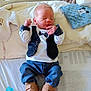 newborn, baby, infant, clothing, vest, bow_tie, jeans, shoes, pacifier, bed, blanket, pillow, sleeping, cute, small, child, indoors, soft, fabric, resting