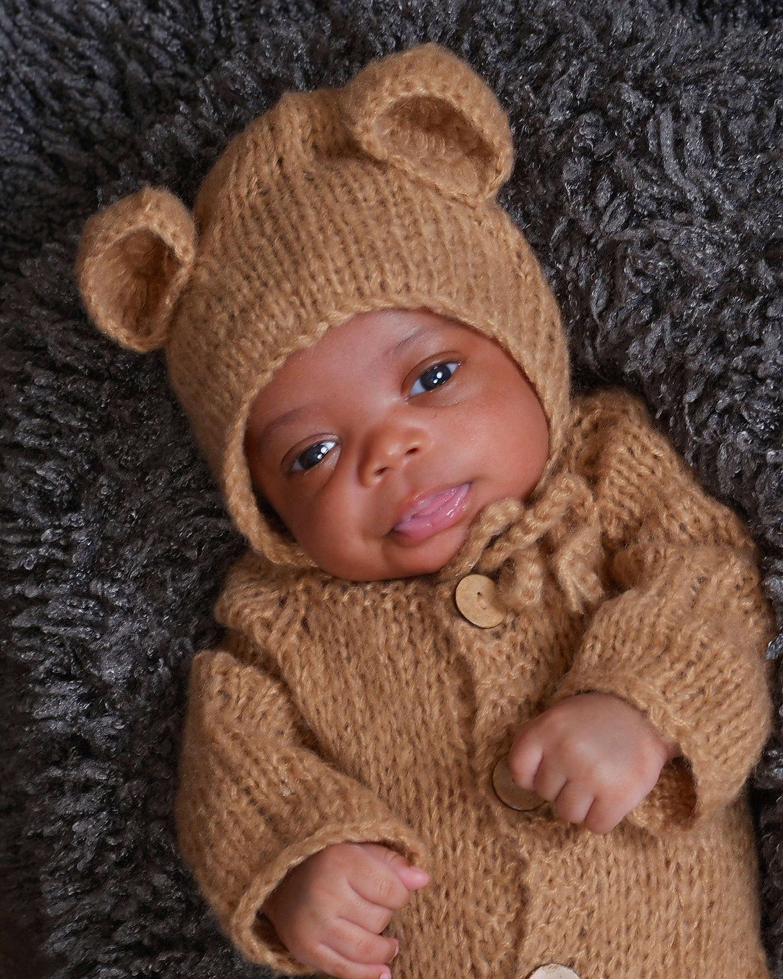 Drew is registered to the contest to win money with this photo: baby, baby_toddler_clothing, cap, cheek, chin, comfort, eye, face, happy, hat, head, headwear, human_body, knit_cap, lip, nose, person, skin, sleeve, smile