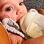 Jeremiah joined the competition — help win amazing prizes! arm, baby, blanket, bottle, child, closeup, comfort, cute, eyes, face, feeding, human, indoor, infant, milk, nurture, person, skin, texture, young