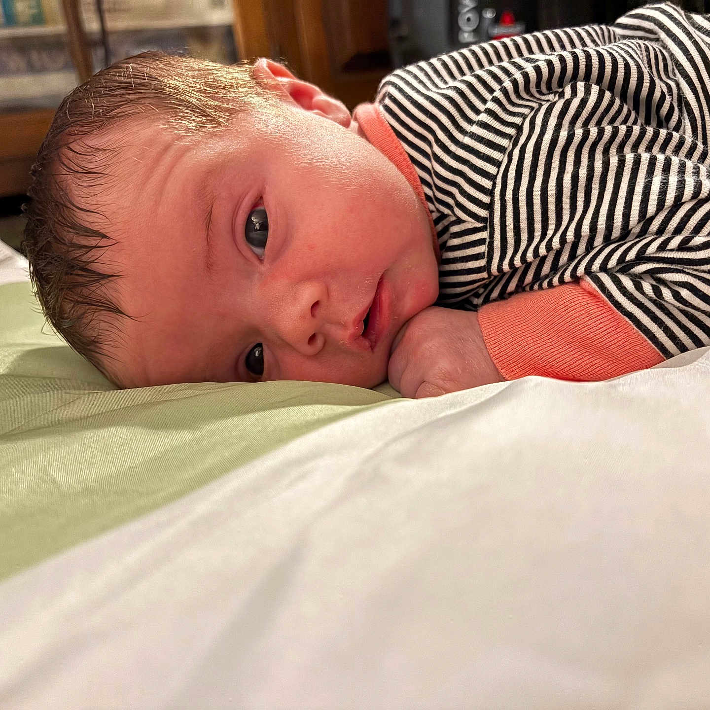 Catherine joined the competition — help win amazing prizes! baby, bed, blanket, closeup, comfort, cute, expression, face, hand, head, indoors, infant, lying_down, pajamas, portrait, resting, skin, sleepy, striped_clothing, young_child