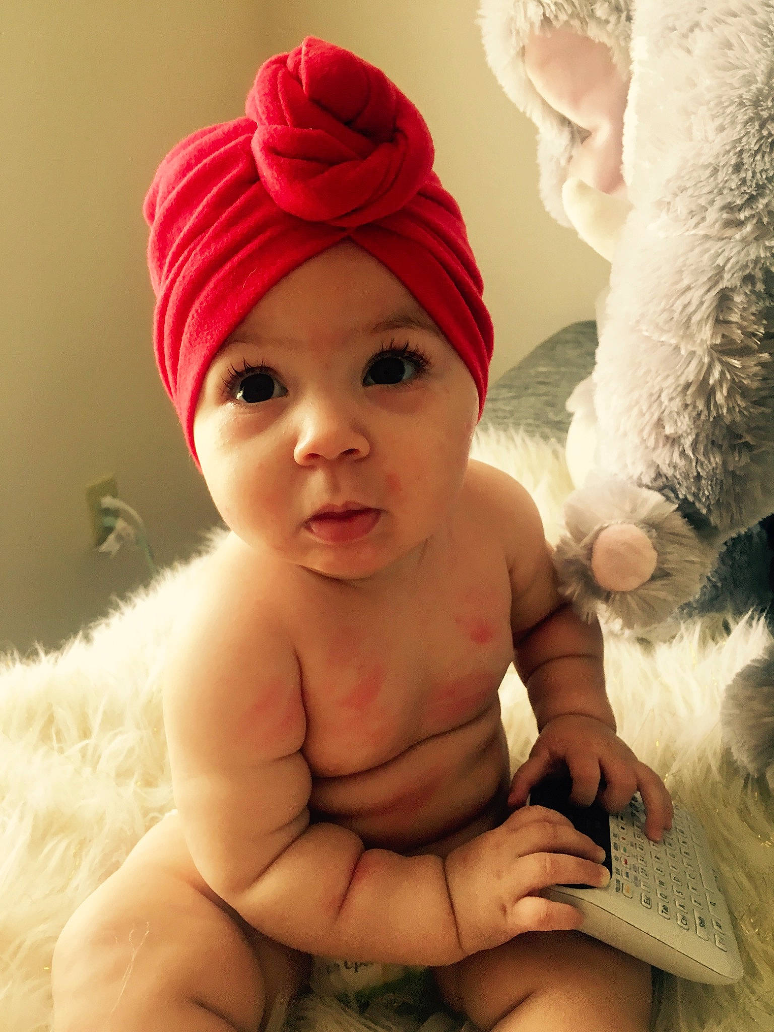 Myla is registered to the contest to win money with this photo: baby, beanie, bonnet, cap, cheek, child, costume_accessory, fashion_accessory, finger, fur, hair_accessory, hand, hat, headgear, knit_cap, person, pink, skin, smile, toddler