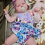 baby, infant, pacifier, headband, purple, butterfly_pattern, stuffed_animal, pink_bunny, blanket, adult, man, closeup, skin, clothing, sleepy, lying_down, hand, foot, family, indoor