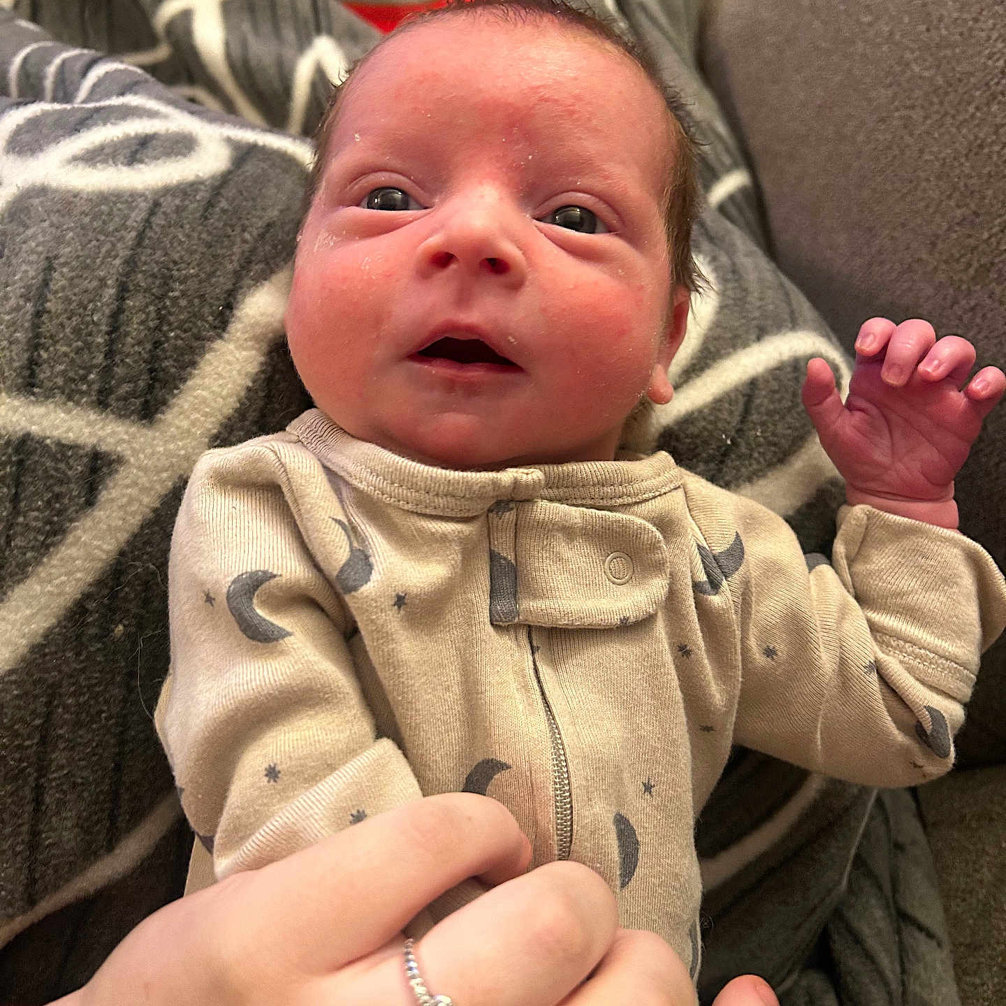 Hunter is registered to the contest to win money with this photo: accessories, baby, blanket, bodypart, clothing, coat, couch, diamond, face, finger, gemstone, hand, head, jacket, jewelry, newborn, person, photography, portrait, ring