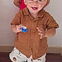 toddler, child, smiling, indoor, brown_shirt, shorts, pacifier, happy, blond_hair, blue_eyes, floor, wooden_floor, person, standing, two_children, red_shirt, background, blurred, cute, playful