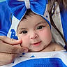 Nathaly is registered to the contest to win money with this photo: baby, child, bow, blue, blanket, cheek, cute, face, hand, headwear, infant, person, portrait, smile, soft_skin, wrapped, white, young, closeup, adorable