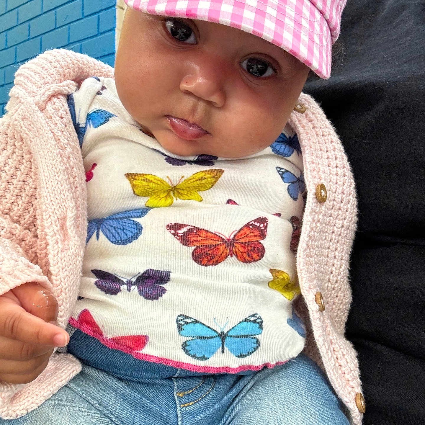 Harmony joined the competition — help win amazing prizes! baby, baseballcap, cap, clothing, coat, couch, cushion, face, furniture, hat, head, homedecor, jacket, jeans, knitwear, pants, person, photography, portrait, sweater