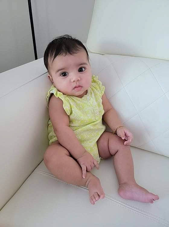 Gia joined the competition — help win amazing prizes! baby, baby_toddler_clothing, barefoot, cheek, child, comfort, eye, finger, flooring, foot, human_leg, knee, neck, person, shoulder, sitting, skin, sleeve, thigh, thumb