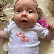 Capri participe au concours pour gagner de l'argent avec cette photo : baby, infant, onesie, pacifier, soft_toys, blanket, cute, face, portrait, lying_down, closeup, chubby_cheeks, expression, indoor, child, newborn, clothing, pink, white, comfort