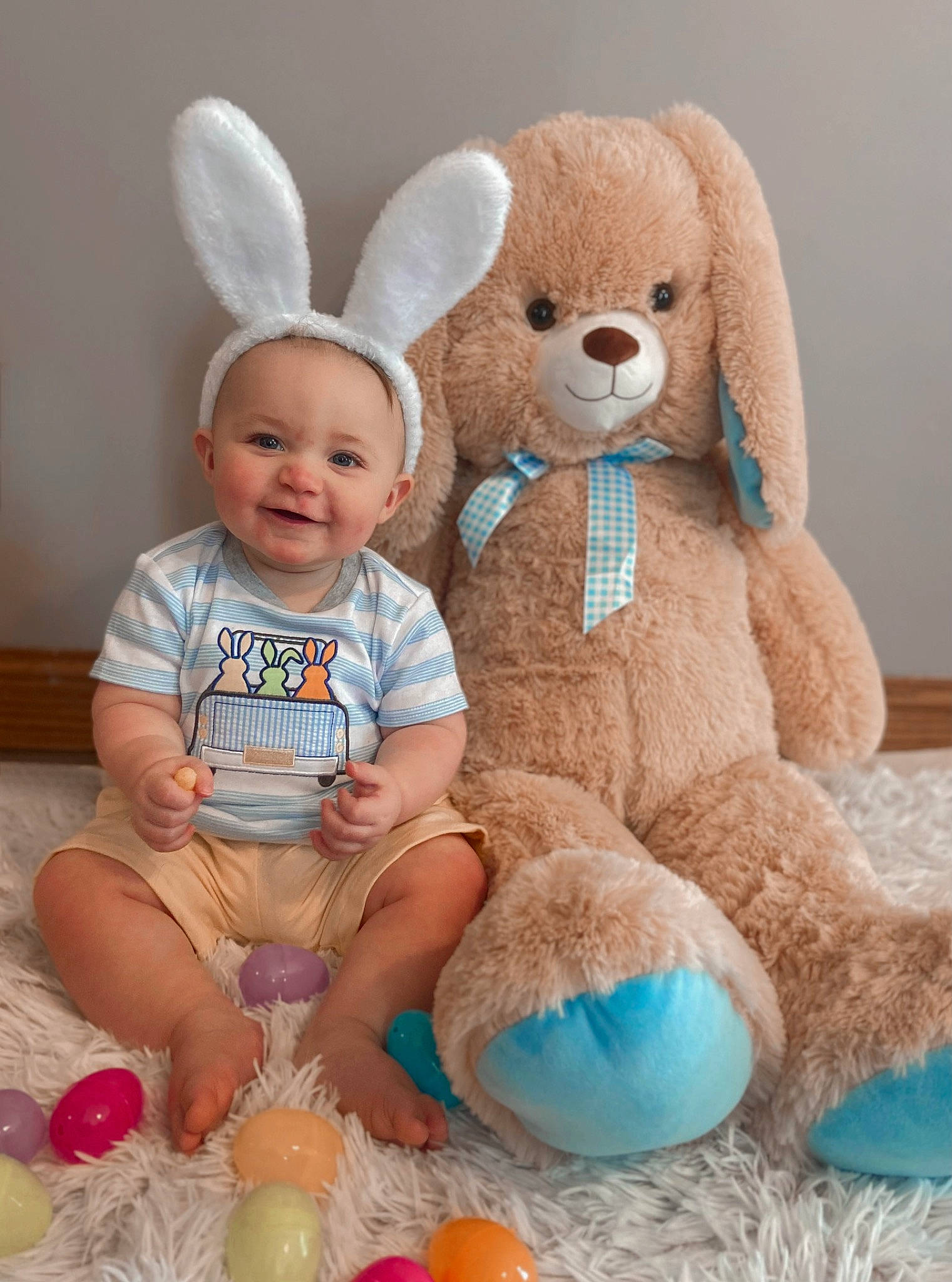 Levi is registered to the contest to win money with this photo: baby, baby_toddler_clothing, baby_toys, child, event, fawn, fun, happy, head, joy, person, pink, plush, product, rabbit, skin, smile, stuffed_toy, textile, toddler