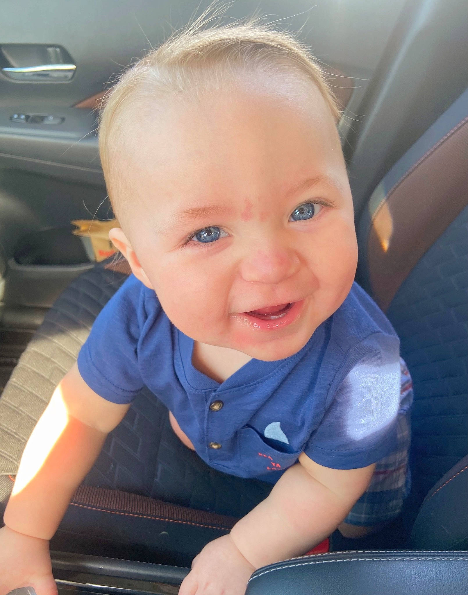 Levi joined the competition — help win amazing prizes! auto_part, automotive_exterior, automotive_tire, baby, baby_toddler_clothing, blond, car_seat, cheek, child, electric_blue, family_car, fun, happy, iris, person, skin, smile, steering_wheel, t_shirt, toddler