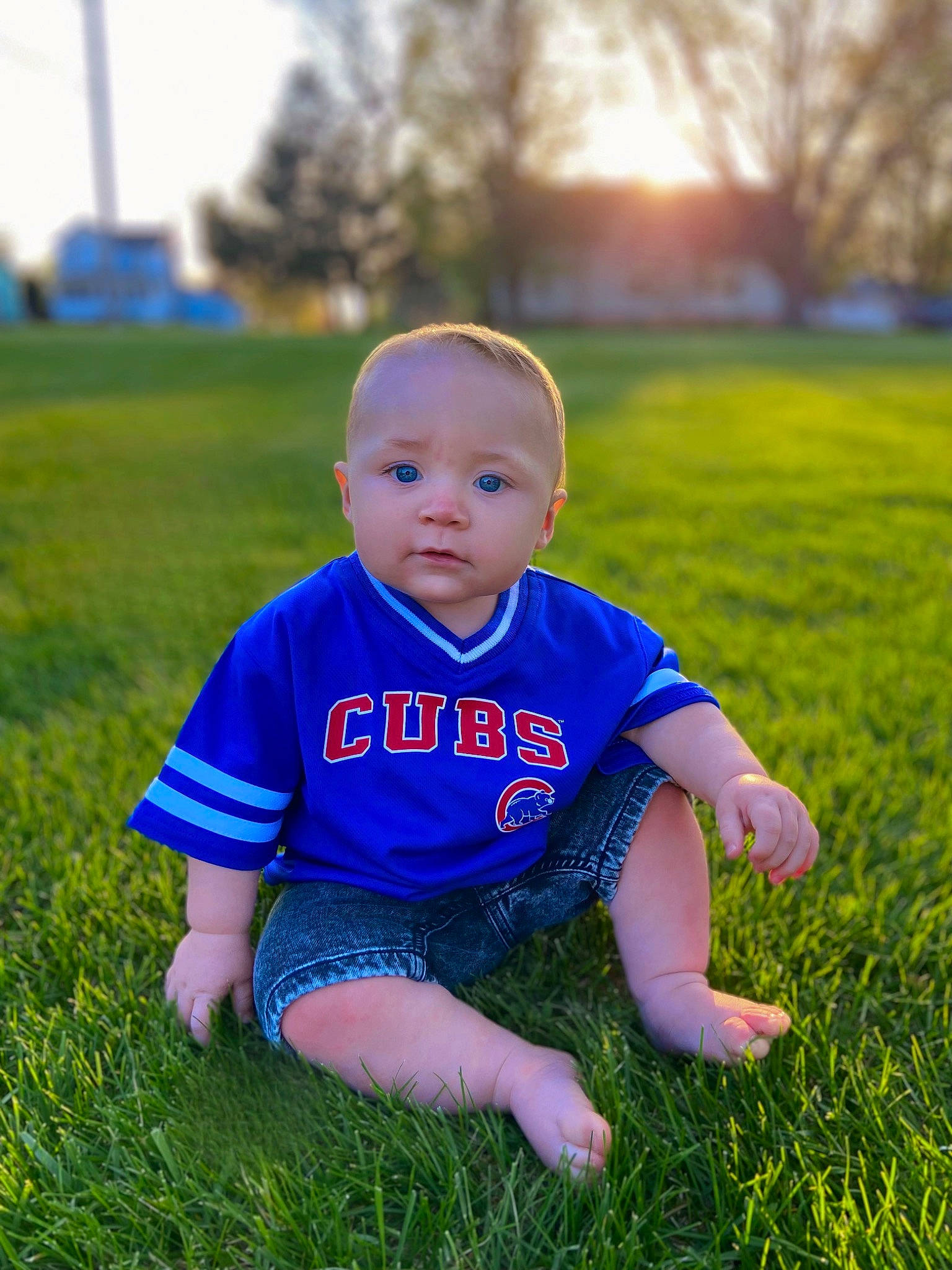 Levi is registered to the contest to win money with this photo: baby, baby_toddler_clothing, electric_blue, flash_photography, flooring, fun, grass, grass_family, grassland, happy, lawn, leisure, meadow, people_in_nature, person, plant, recreation, sky, smile, t_shirt
