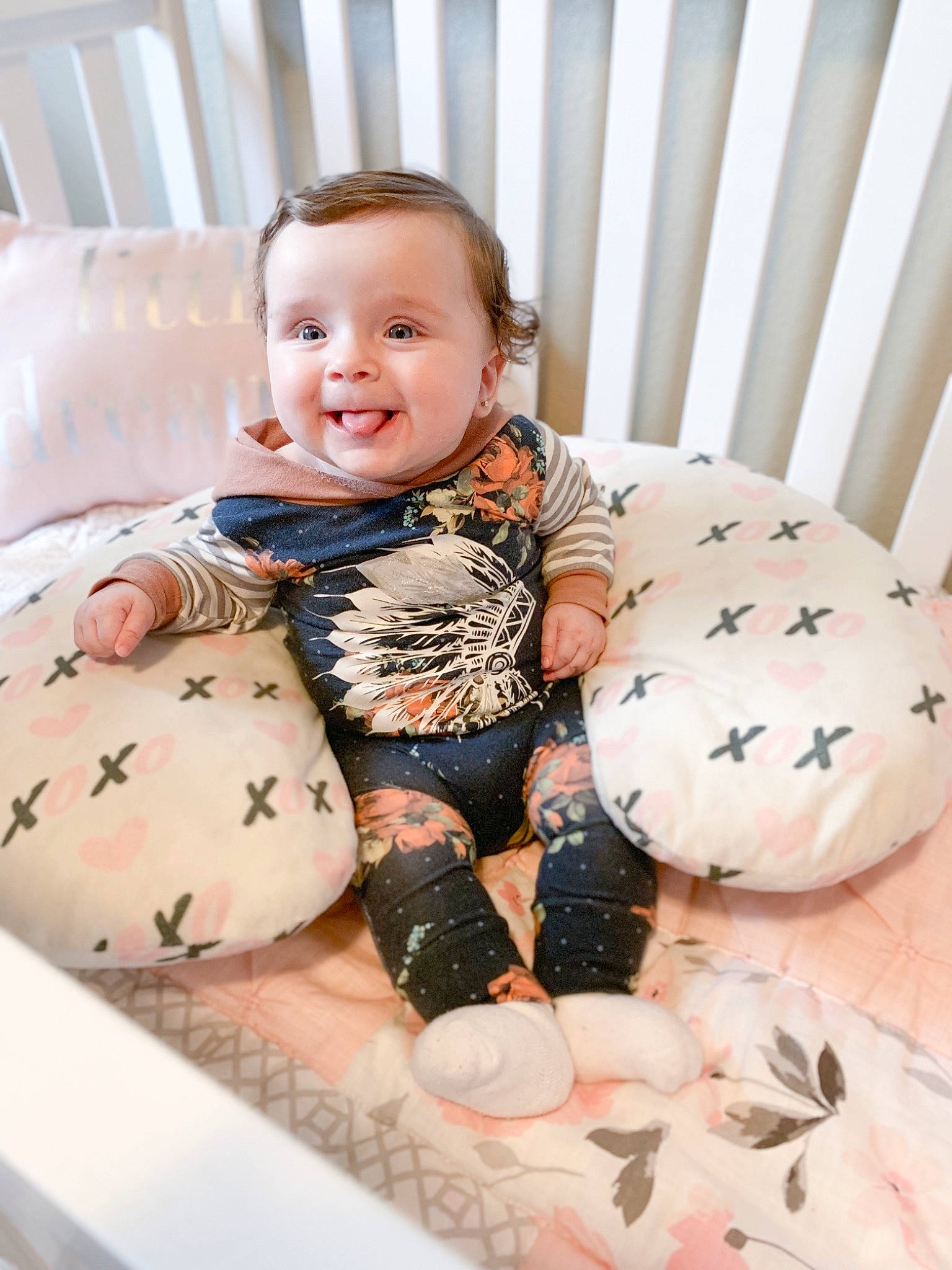 Raeleigh is registered to the contest to win money with this photo: baby, baby_products, baby_toddler_clothing, child, design, furniture, joy, pattern, person, pink, product, room, skin, textile, toddler