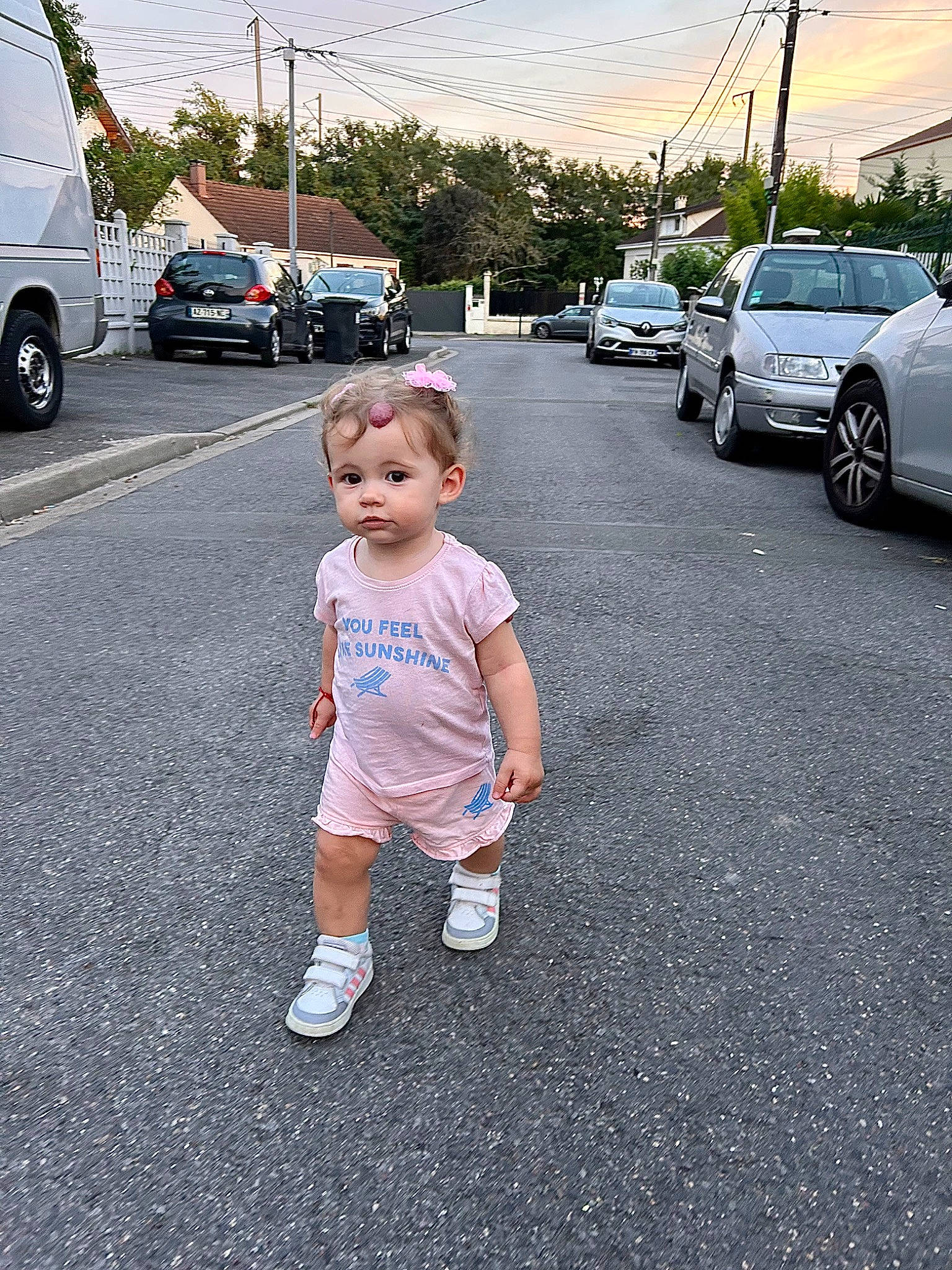 Amalia participe au concours pour gagner de l'argent avec cette photo : asphalt, automotive_lighting, automotive_tire, car, footwear, infrastructure, land_vehicle, morning, motor_vehicle, person, public_space, road, road_surface, shorts, sidewalk, sky, tire, toddler, vehicle, vehicle_door