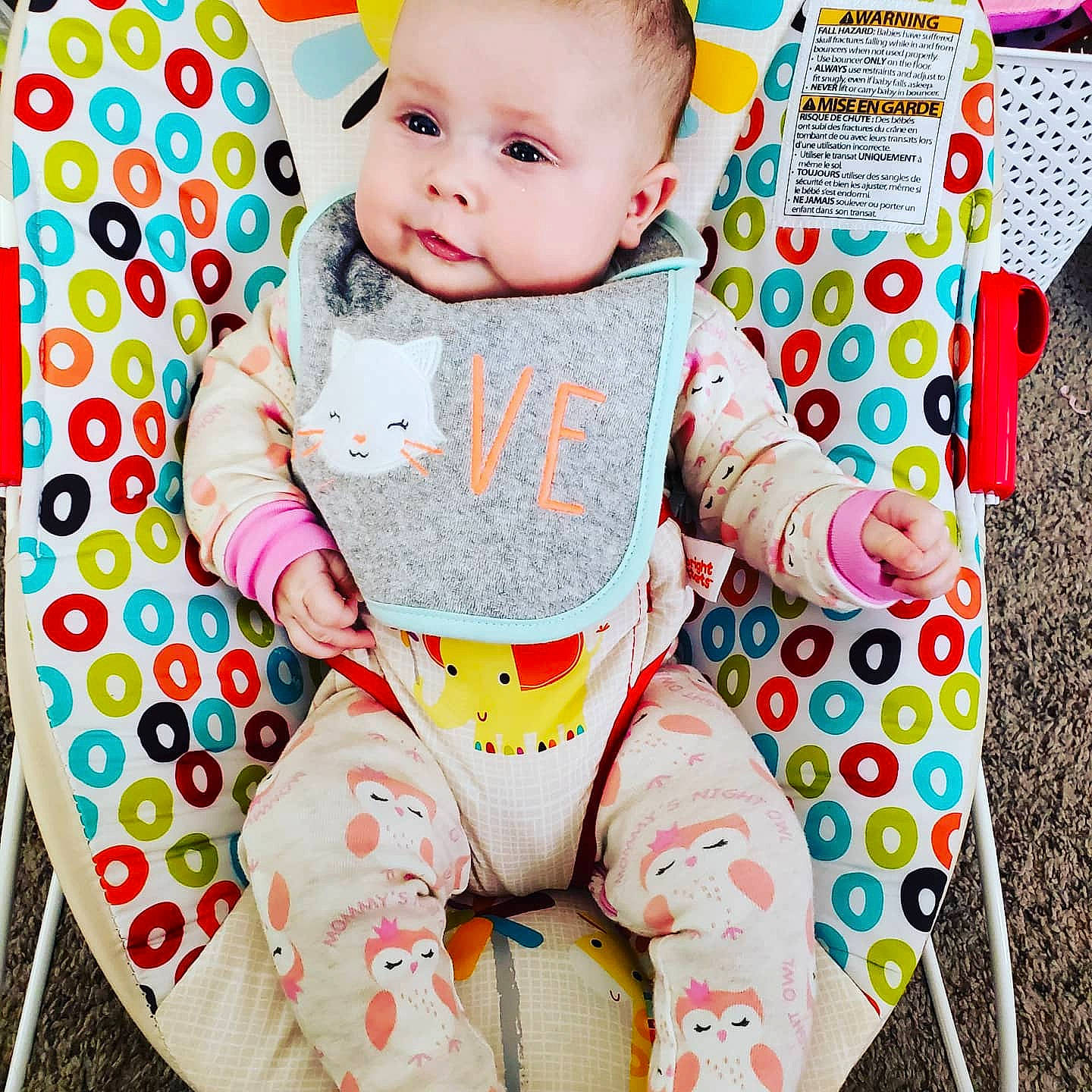 Josephine is registered to the contest to win money with this photo: baby, baby_toddler_clothing, cheek, child, collar, comfort, facial_expression, green, happy, head, linens, pattern, person, photograph, pink, product, skin, sleeve, t_shirt, textile