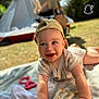 baby, blanket, cap, child, clothing, cute, daylight, face, giraffe, grass, hands, happy, infant, outdoor, play, smiling, stroller, sunlight, tent, toy