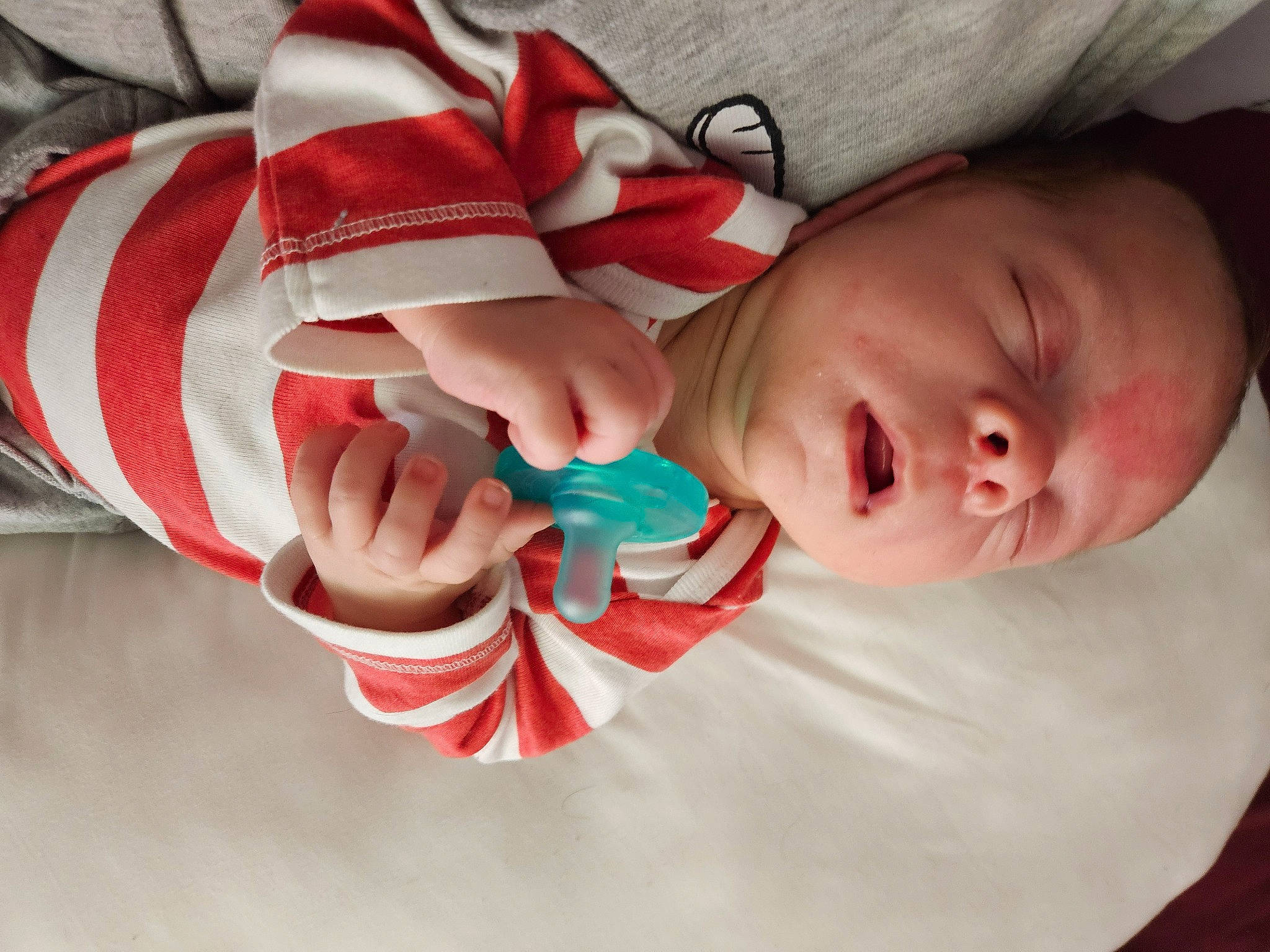 Gavin is registered to the contest to win money with this photo: arm, baby, baby_products, baby_sleeping, baby_toddler_clothing, carmine, cheek, child, comfort, eyelash, finger, hand, linens, nail, pattern, person, sleeve, textile, thumb, toddler