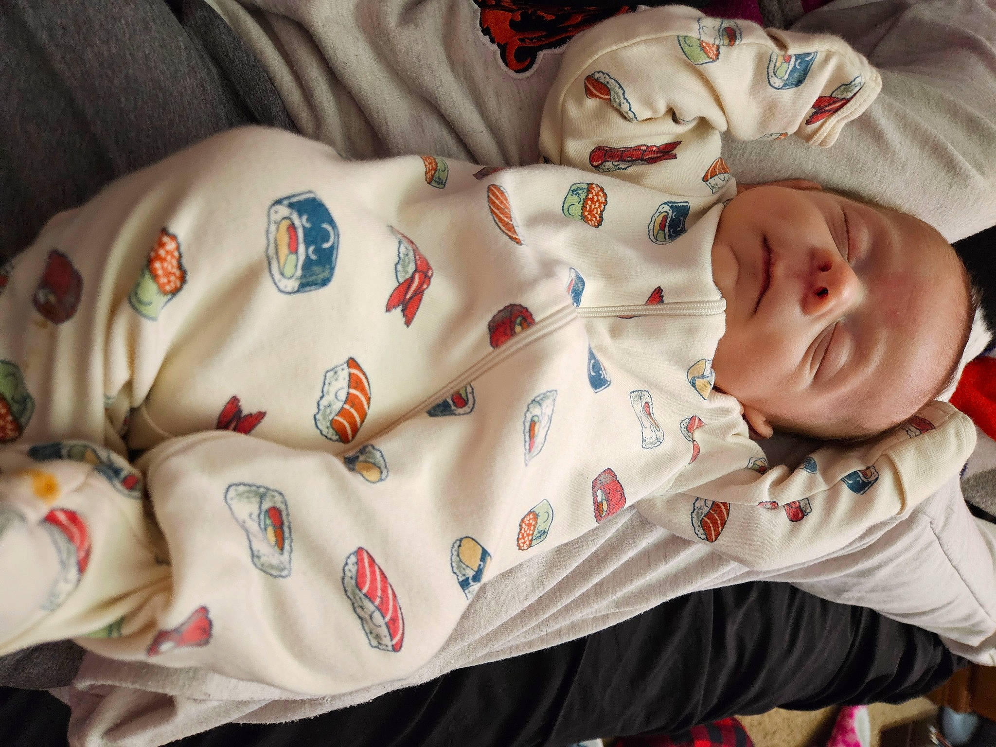 Gavin is registered to the contest to win money with this photo: baby, baby_products, baby_safety, baby_sleeping, baby_toddler_clothing, bedding, bedtime, carmine, cheek, child, comfort, human_body, linens, nap, pattern, person, skin, sleeve, textile, toddler