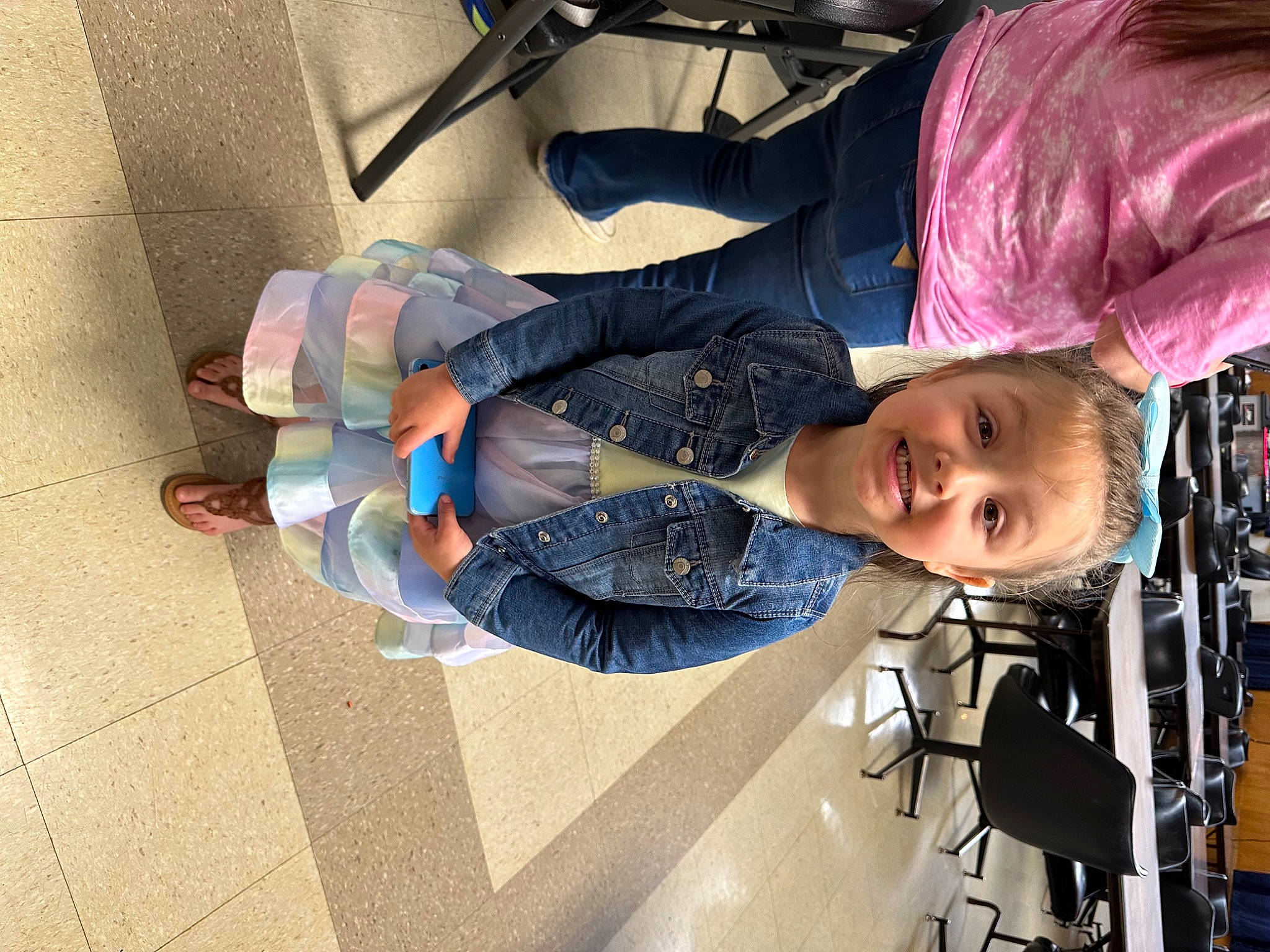 Lindsey joined the competition — help win amazing prizes! chair, child, electric_blue, flooring, fun, human_leg, joy, knee, leisure, pattern, person, sitting, smile, sock, thigh, toddler