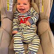 Emerie joined the competition — help win amazing prizes! baby, infant, smiling, laughing, car_seat, seat, safety_label, warning_label, striped_clothing, onesie, booties, hands, eyes, hair, cheeks, tongue, happy, portrait, indoor, fabric