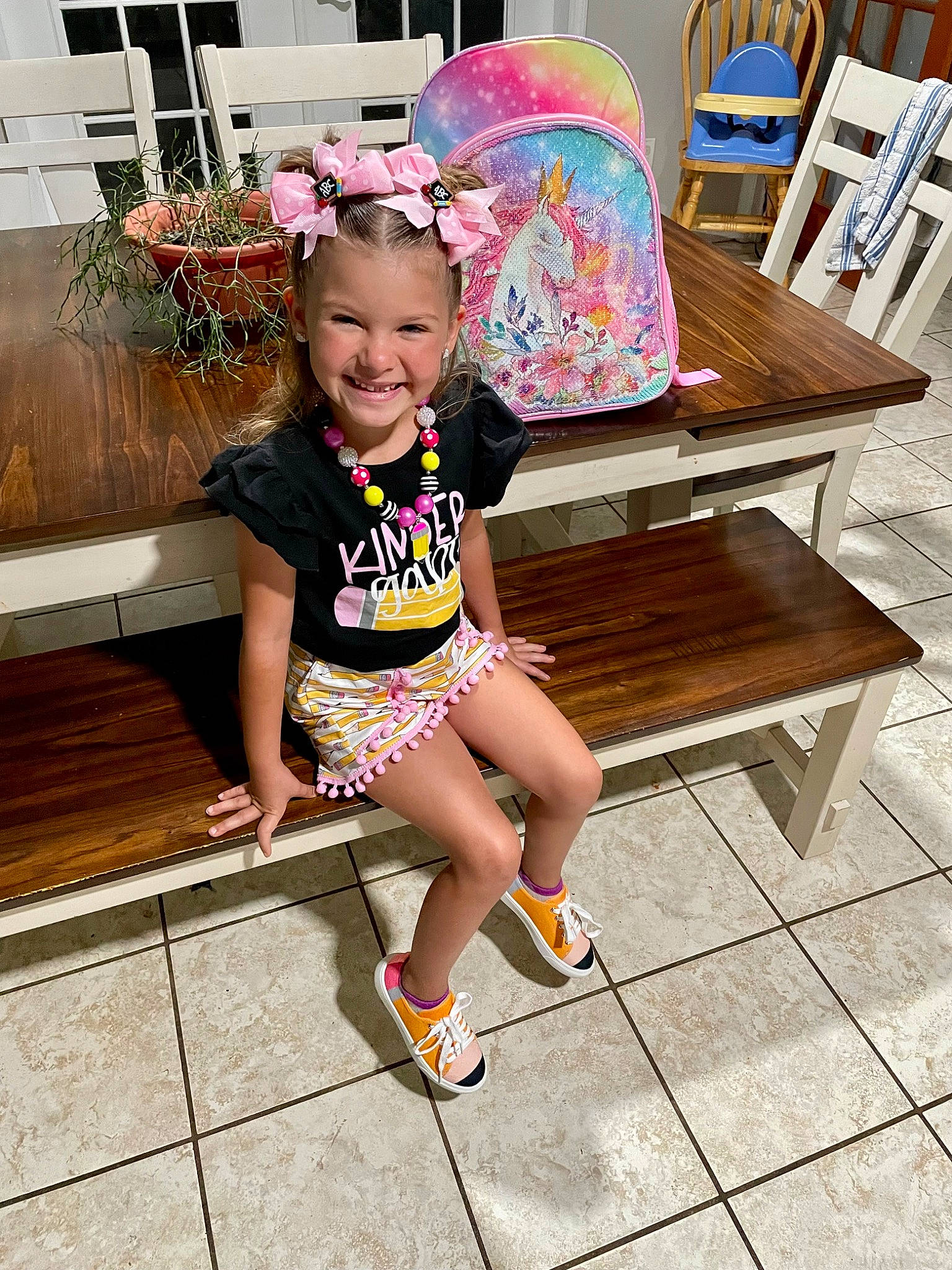 Ella is registered to the contest to win money with this photo: baby_toddler_clothing, barefoot, child, eyewear, fashion_accessory, foot, fun, grass, happy, headwear, human_leg, joy, knee, leisure, magenta, outdoor_furniture, person, pink, sitting, smile