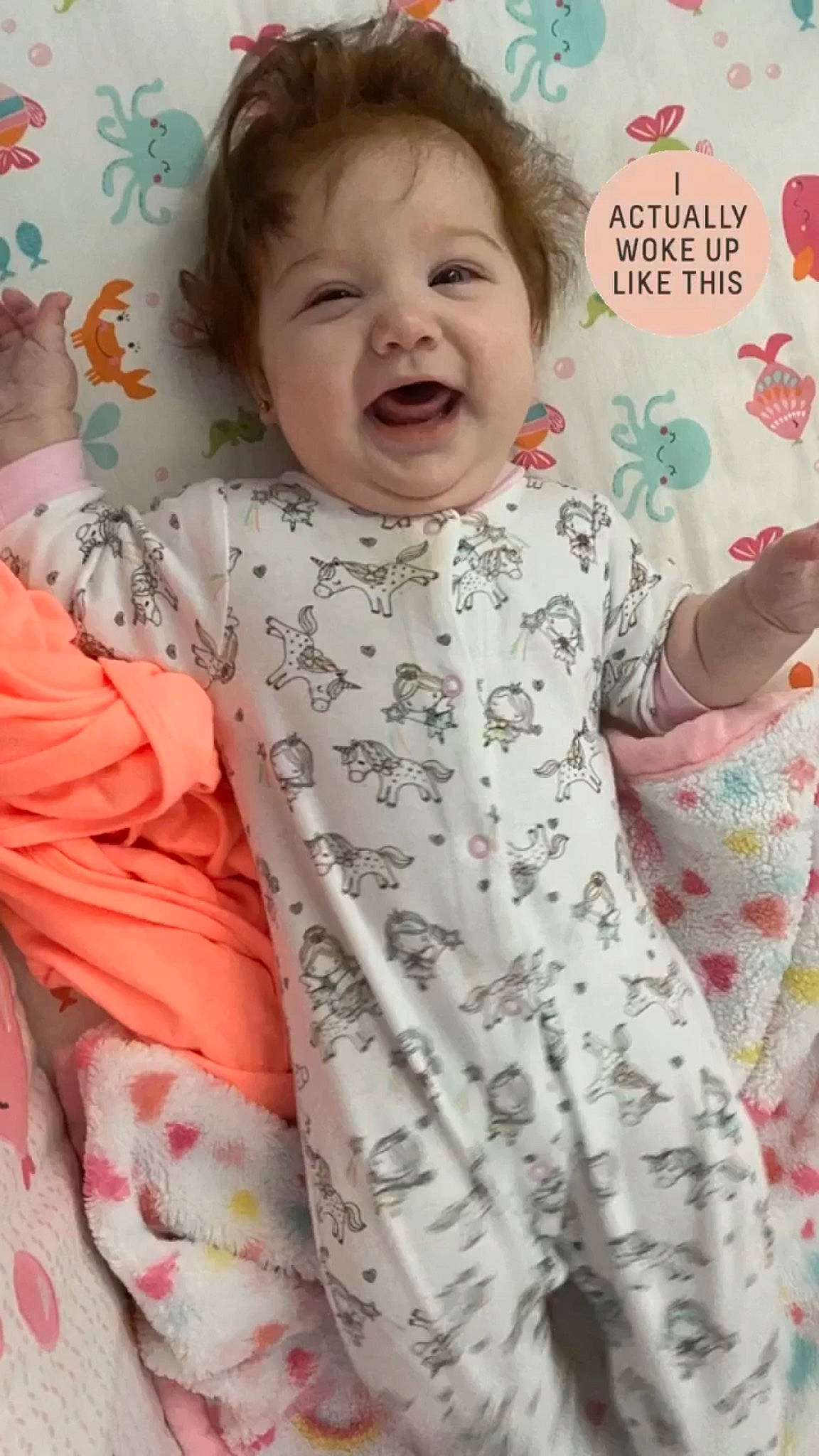 Jenna is registered to the contest to win money with this photo: baby, baby_toddler_clothing, bedtime, cheek, child, facial_expression, nap_mat, pattern, person, sleeve, smile, textile, toddler