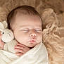Loann participe au concours pour gagner de l'argent avec cette photo : baby, newborn, sleeping, swaddled, blanket, knitted_toy, bunny, soft, fluffy, cute, infant, peaceful, child, portrait, hand, face, closeup, cozy, rest, warm
