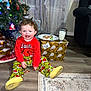 Walker joined the competition — help win amazing prizes! armchair, child, christmas_tree, cookies, curtains, gift_wrap, grinch, happy, holiday, living_room, milk, pajamas, plate, portrait, presents, rug, slippers, smiling, toddler, wooden_floor