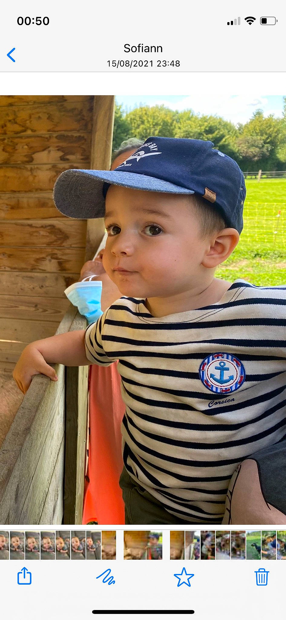 Aydan participe au concours pour gagner de l'argent avec cette photo : baby_toddler_clothing, baseball_cap, blue, cap, clothing, cool, cricket_cap, facial_expression, fun, grass, hairstyle, hat, headwear, leisure, person, public_space, skin, sleeve, standing, t_shirt